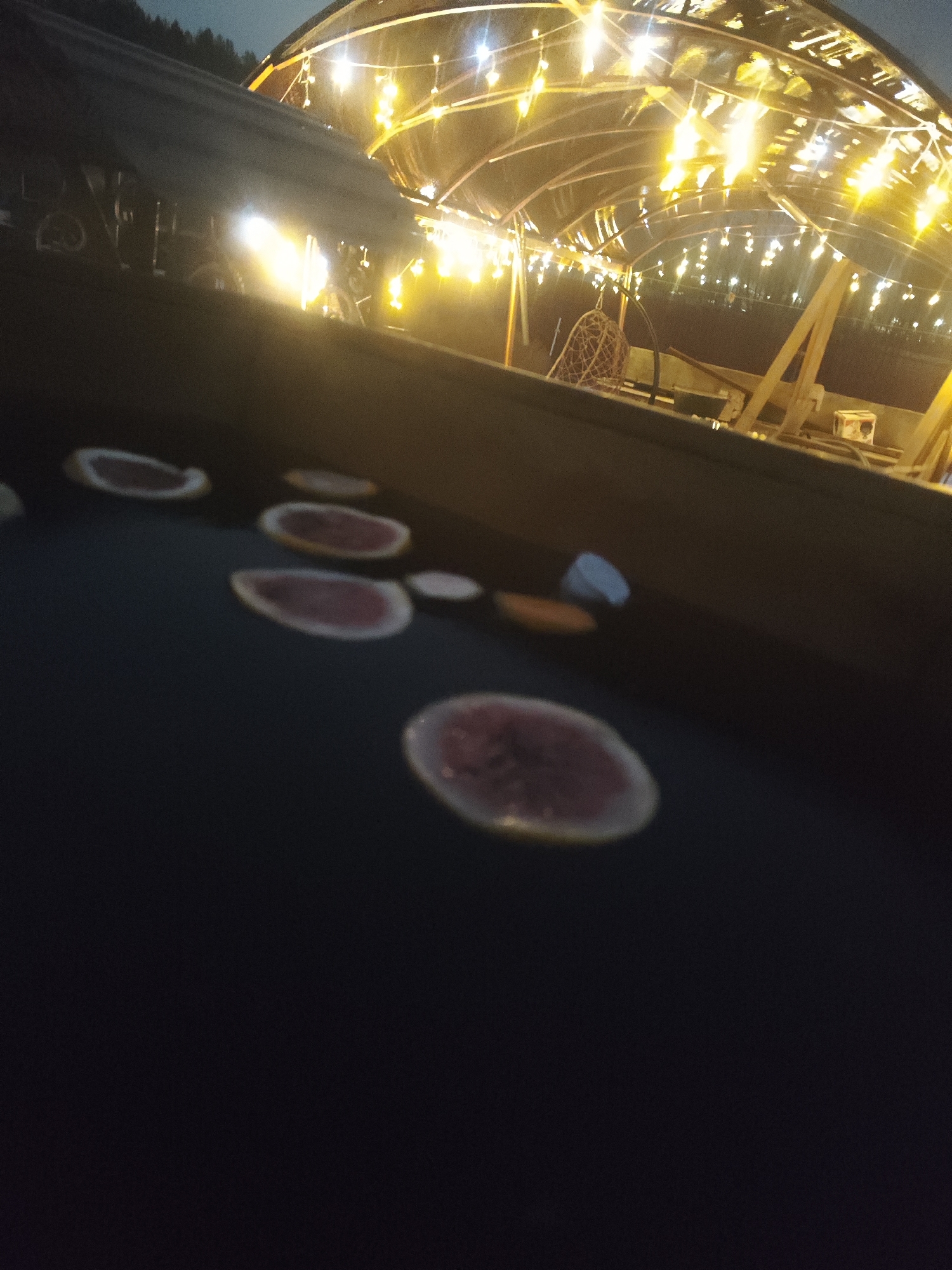 Nighttime hot tub session with grapefruit slices in Chaikovsky