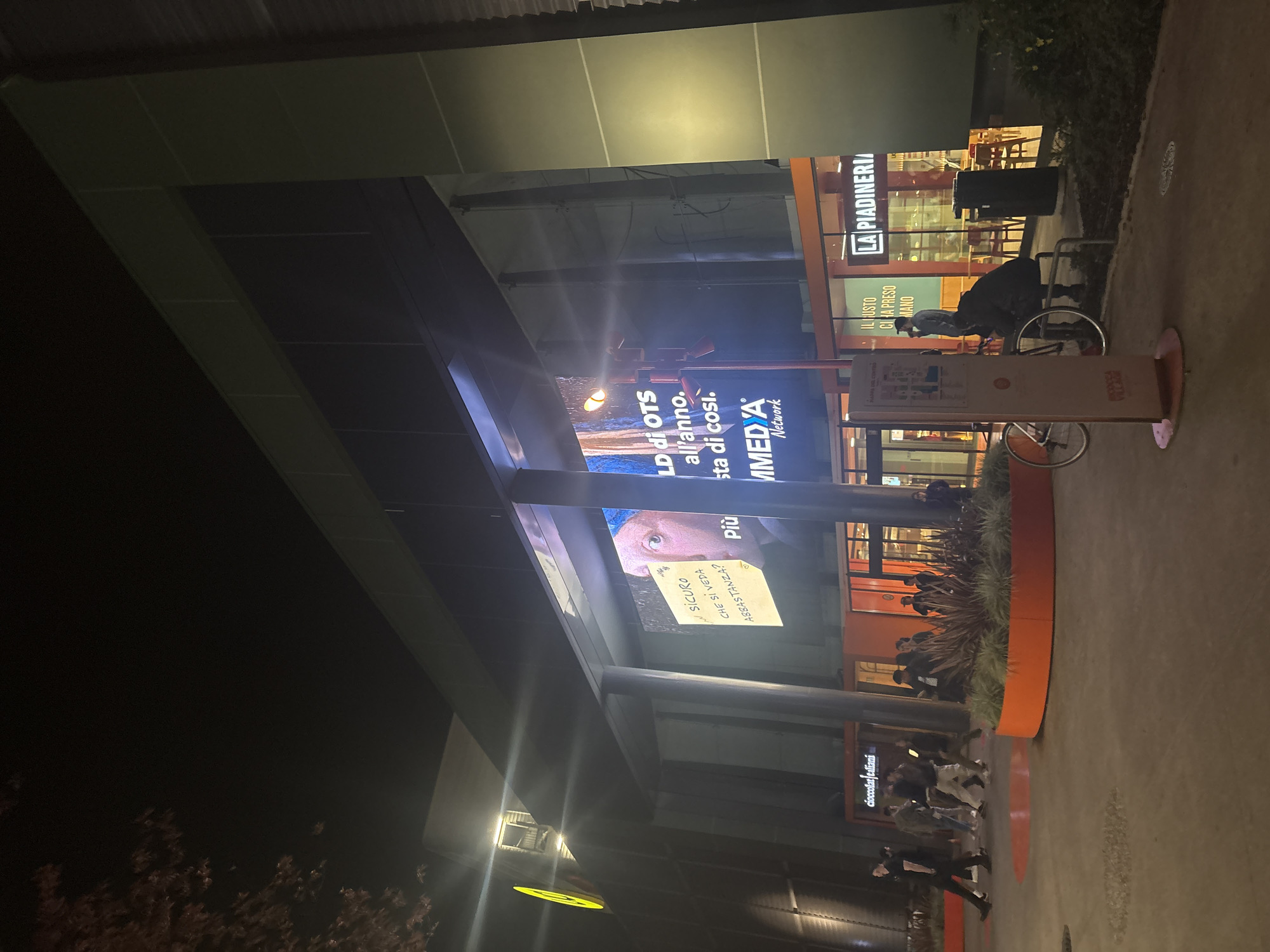 Nighttime commercial area documented in Milan, Italy