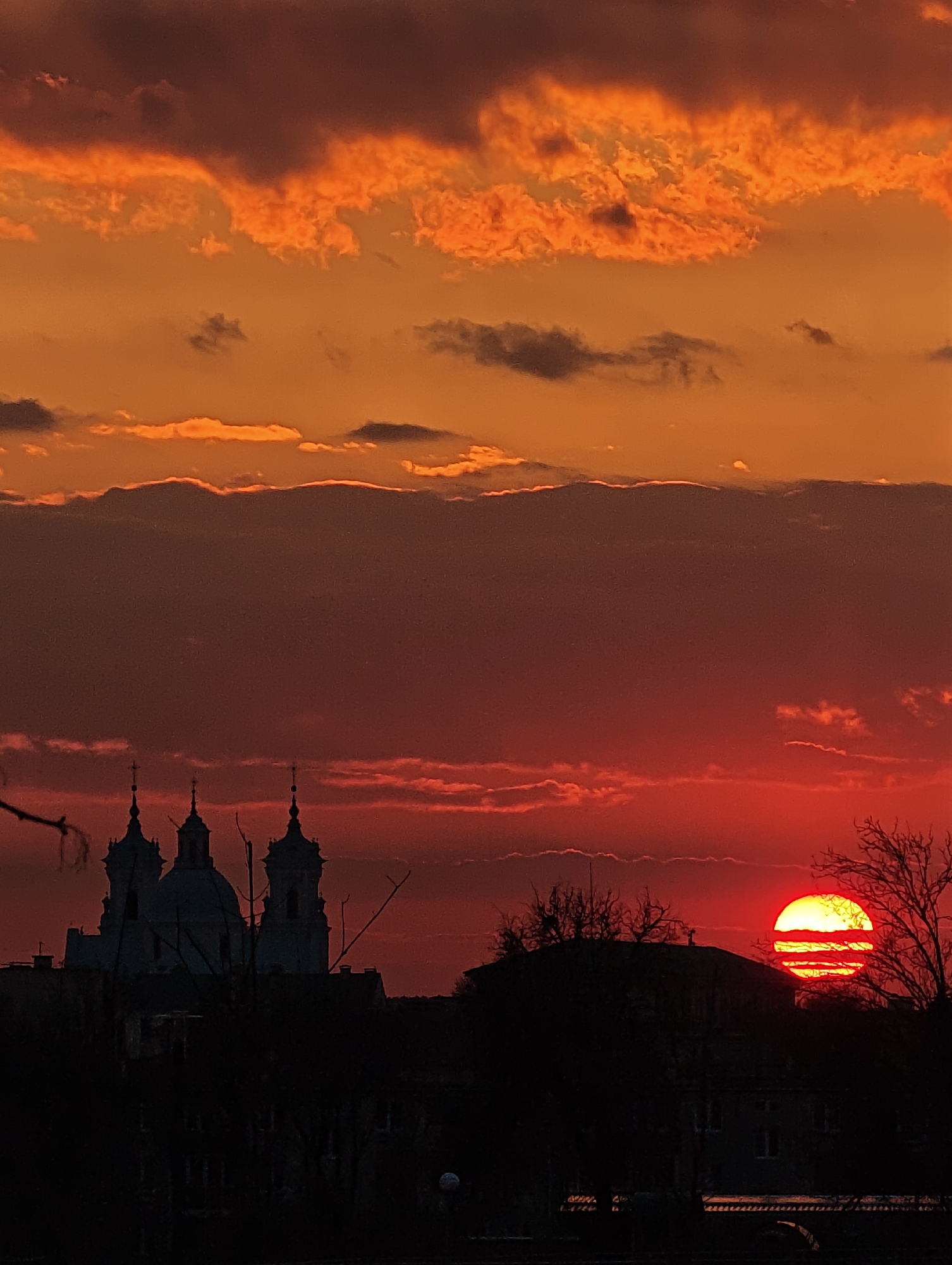 Dramatic sunset silhouettes church in Hrodna, Belarus