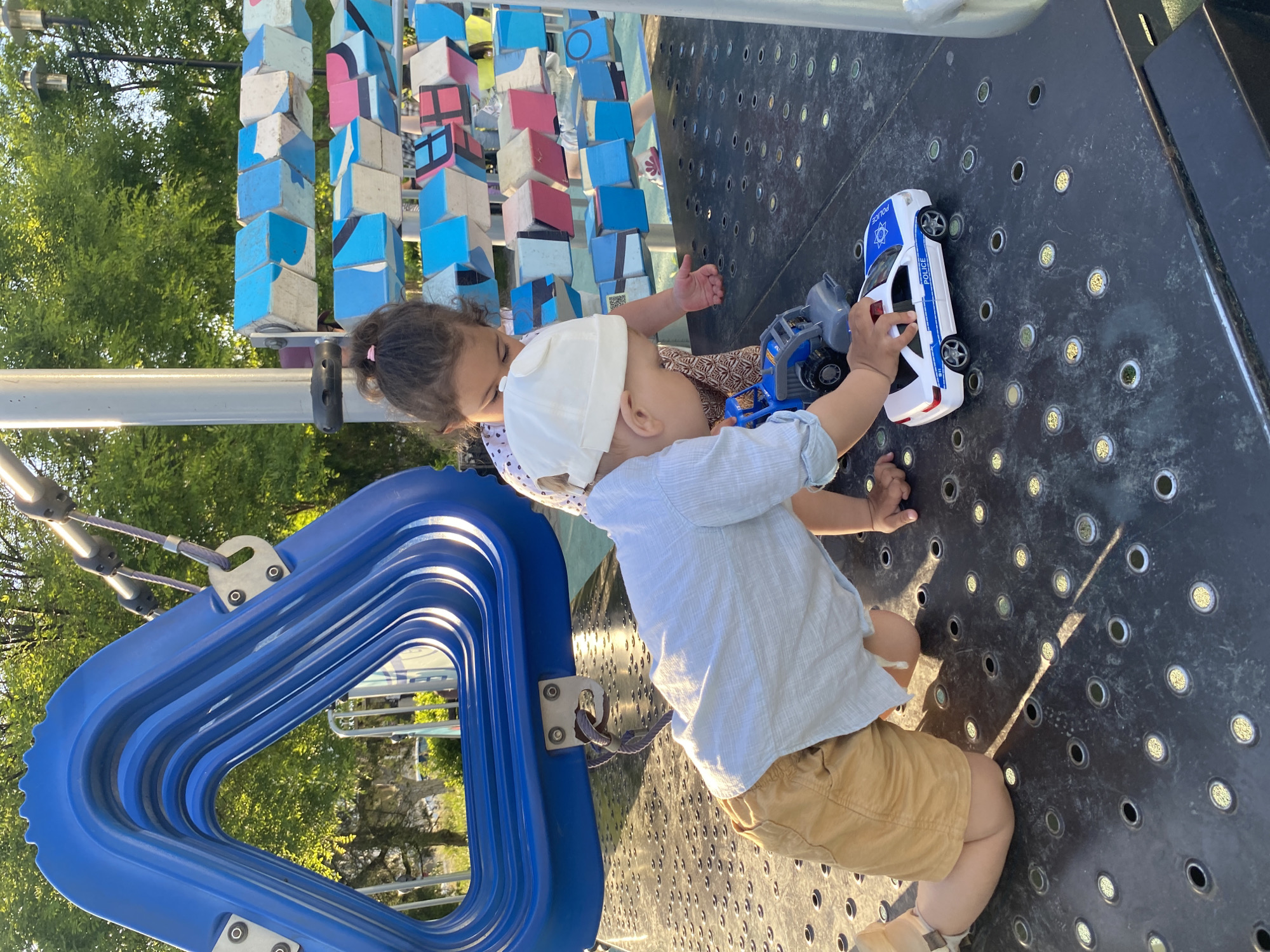 Children play with toy cars at Sevastopol playground