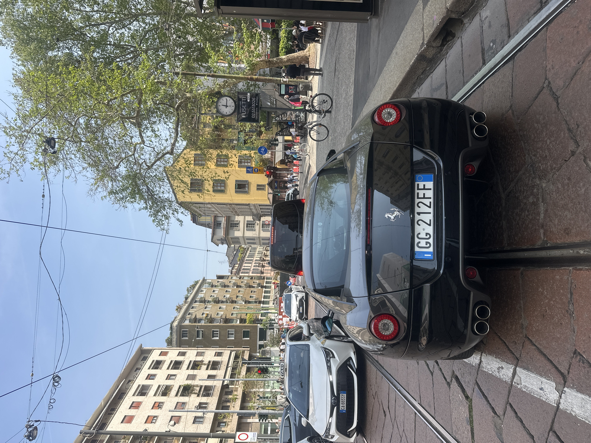 Black Ferrari spotted parked on Milan street with tram tracks