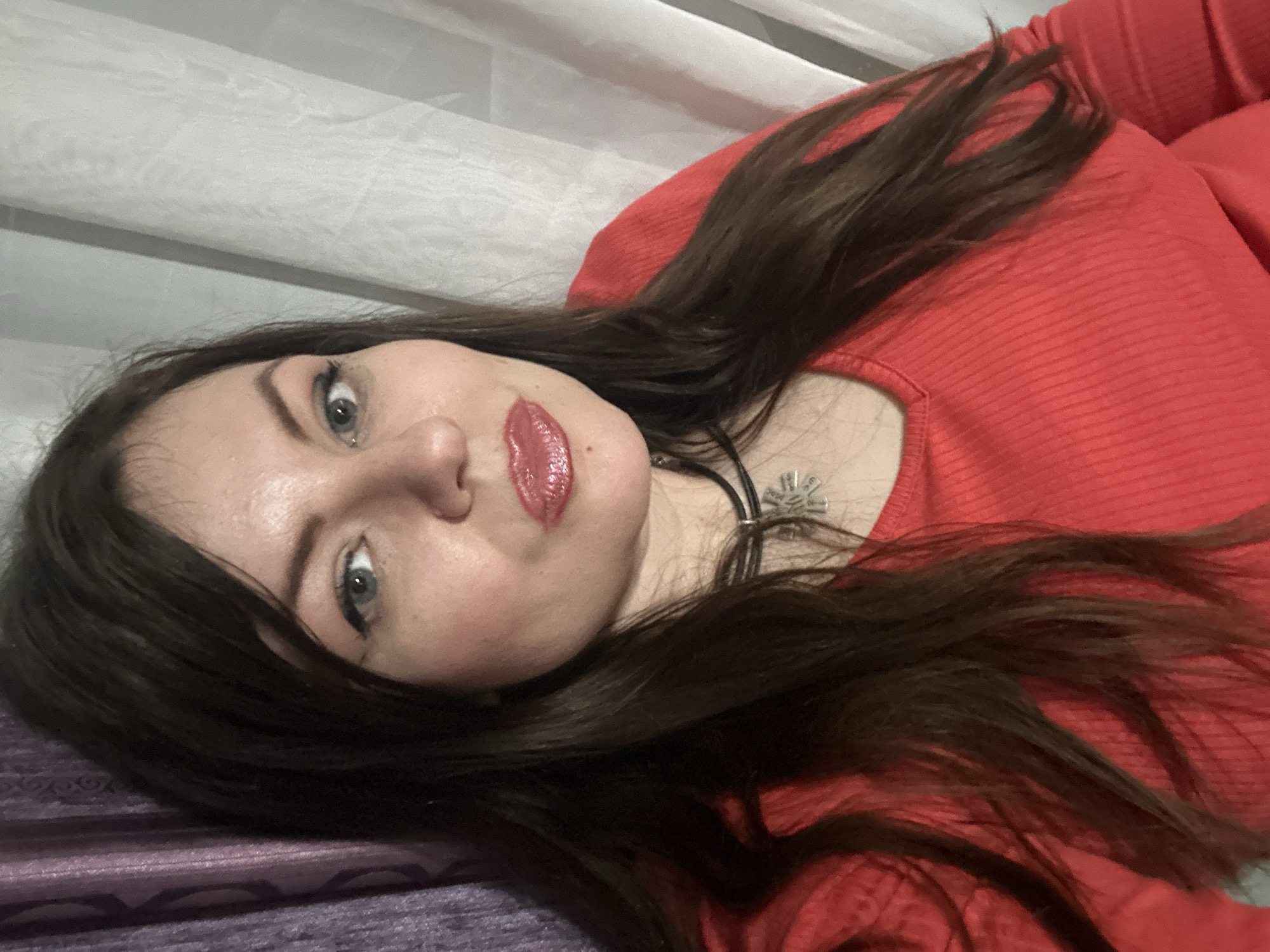 Woman rests on purple surface in Haskovo home