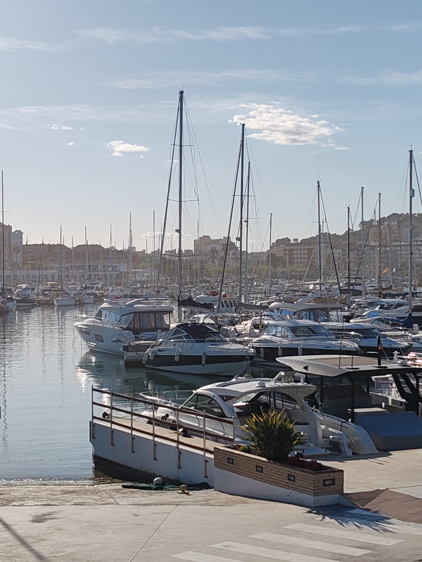 Afternoon stroll captured along Dénia's seaside promenade and marina