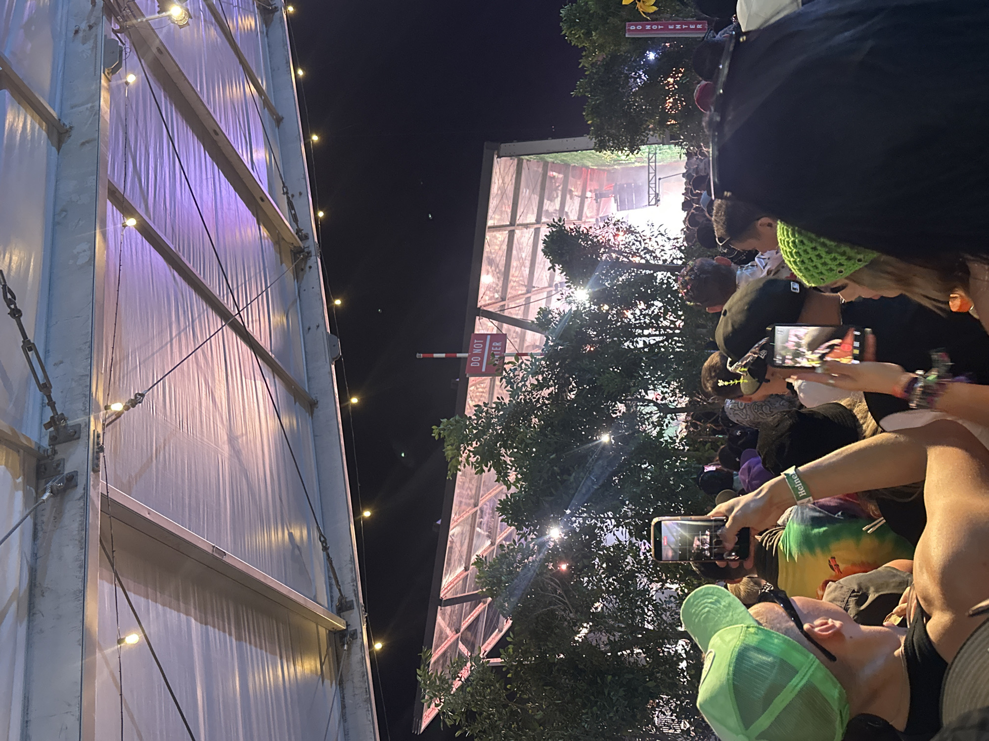 Festival scenes documented including signage, crowds, wooden installation structure