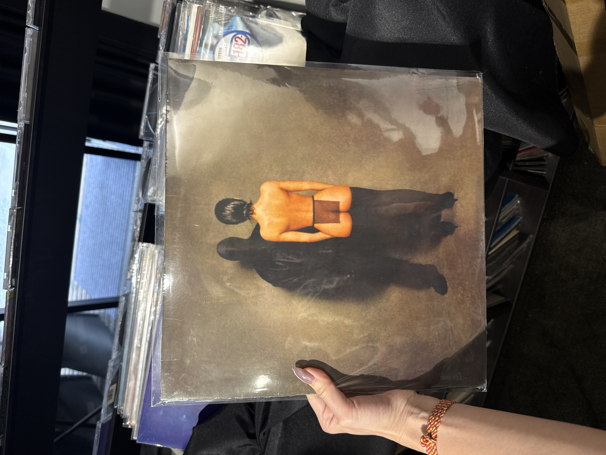Record shop browsing and street scenes documented in Shanghai