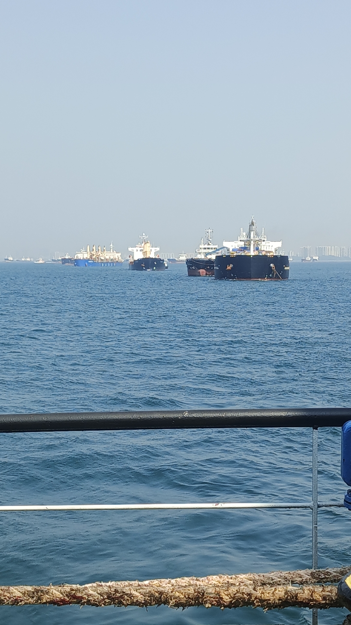 On a vessel in Singapore's anchorage, container ships all around