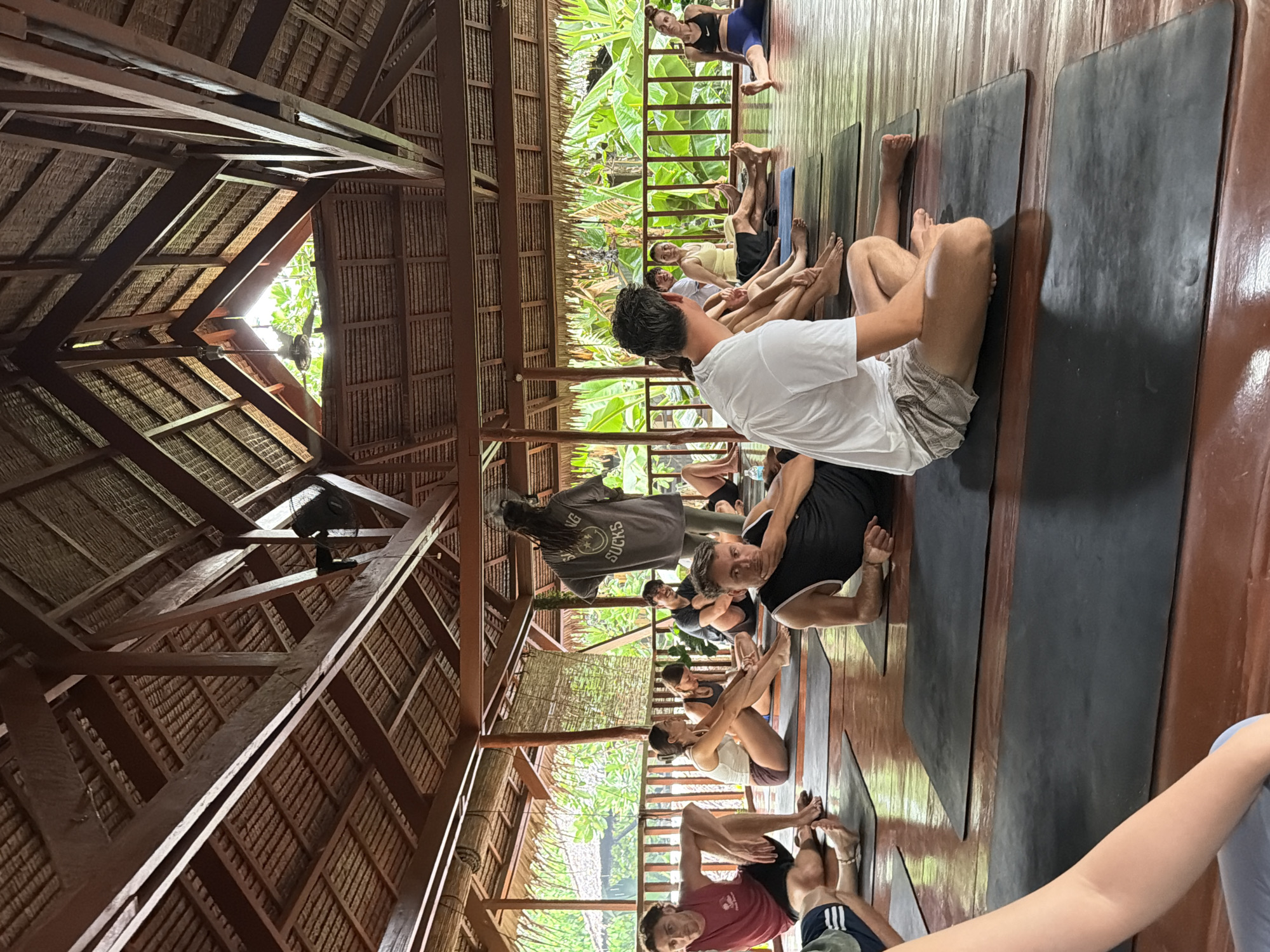Yoga class held in thatched-roof pavilion in General Luna