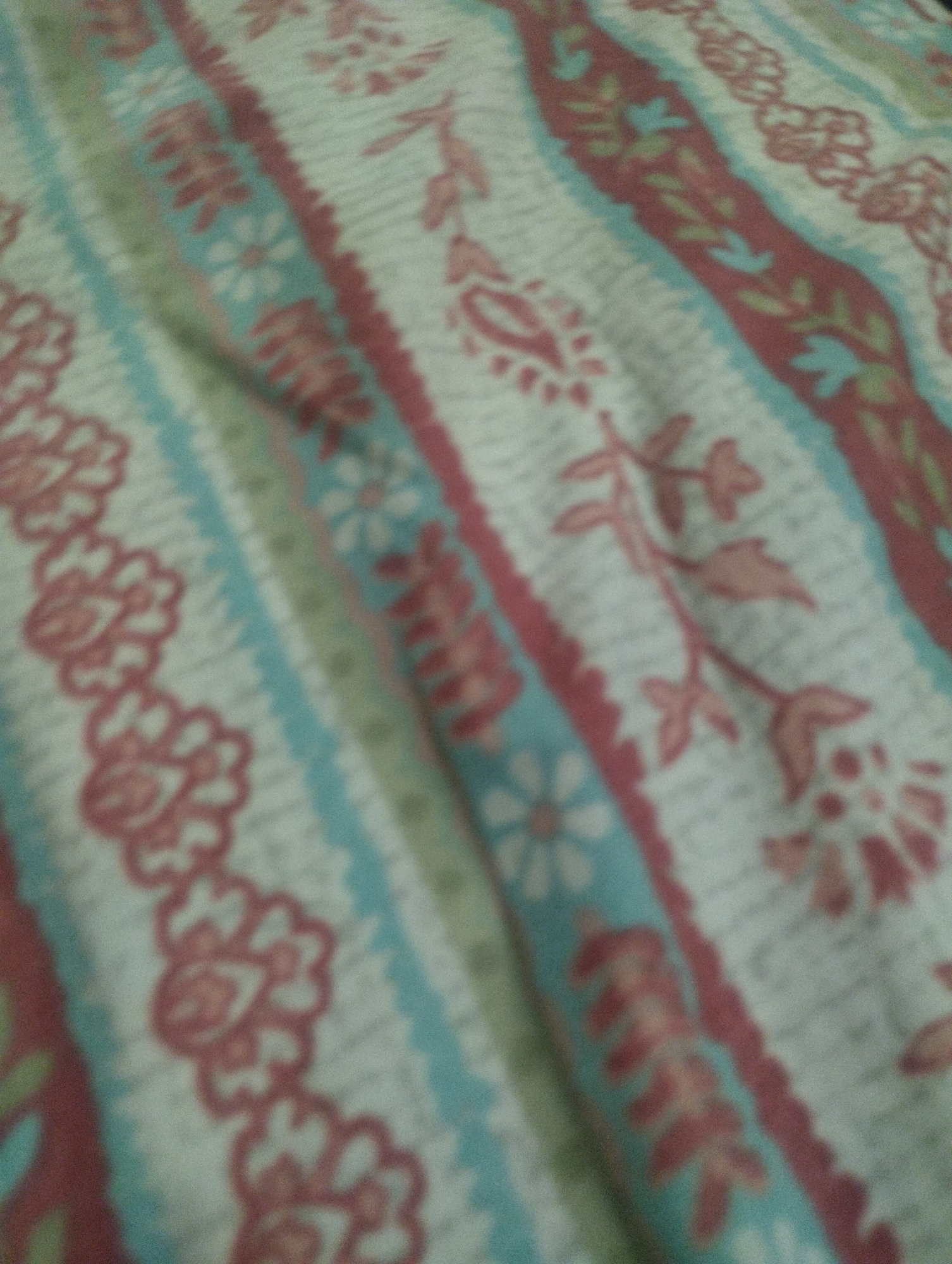 Patterned fabrics and accessories spread out for review