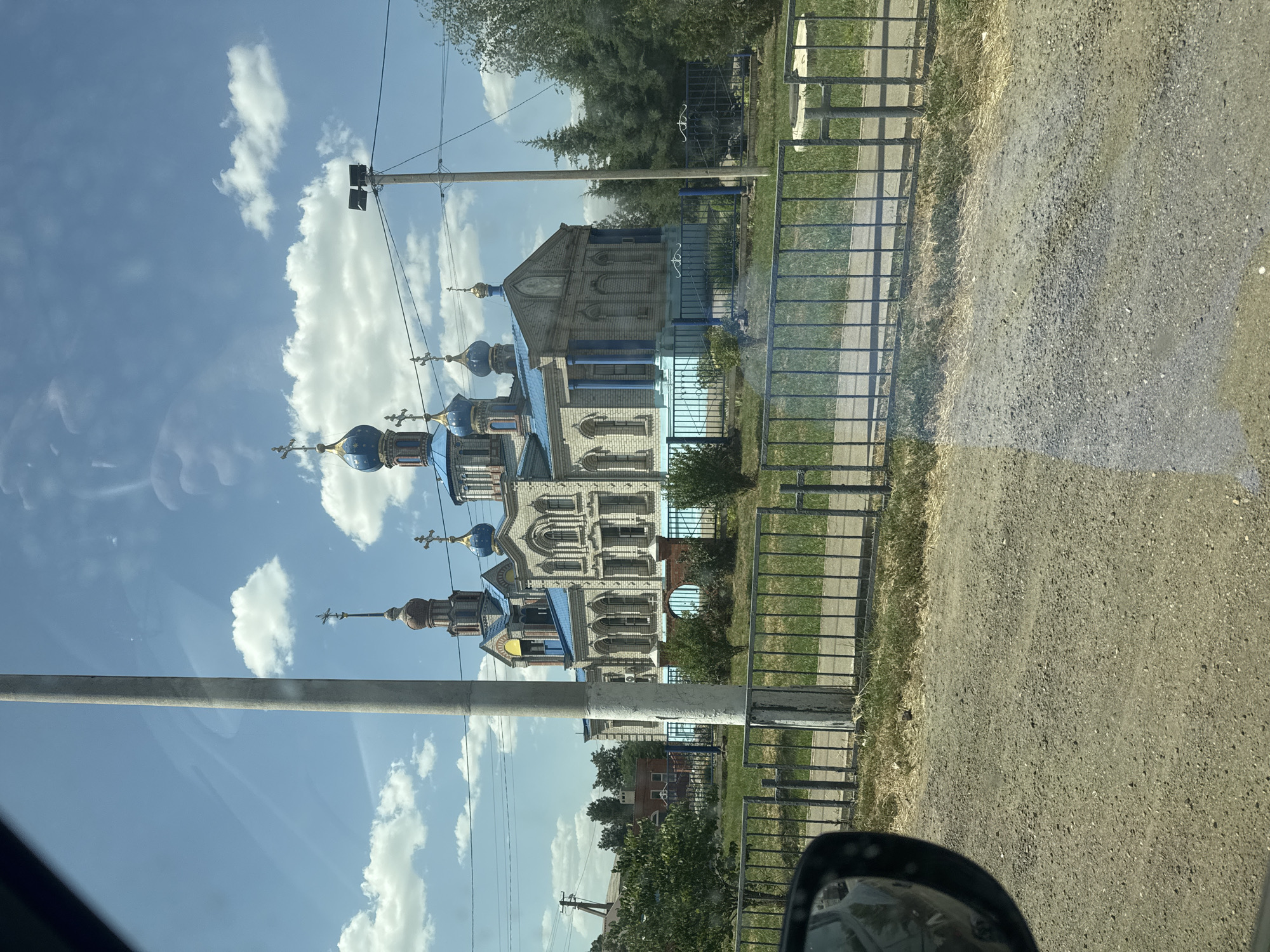 Blue-domed brick Orthodox church in Kisliakovskaya, Russia