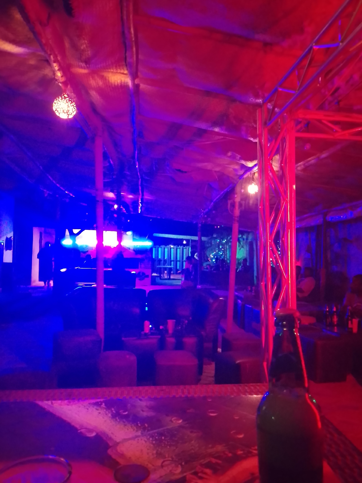 Nightclub interior captured with vibrant blue-red lighting