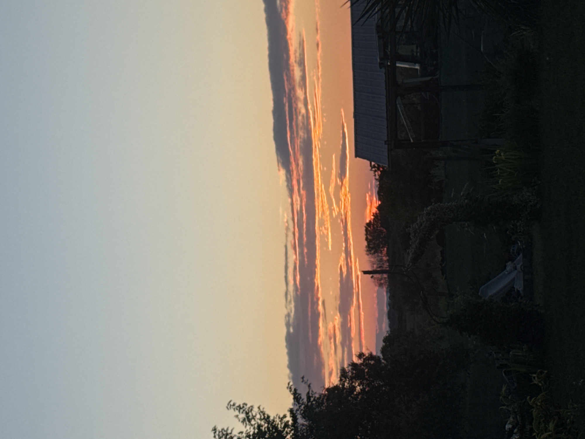Rural sunset captured near Generalovo, Bulgaria with agricultural buildings