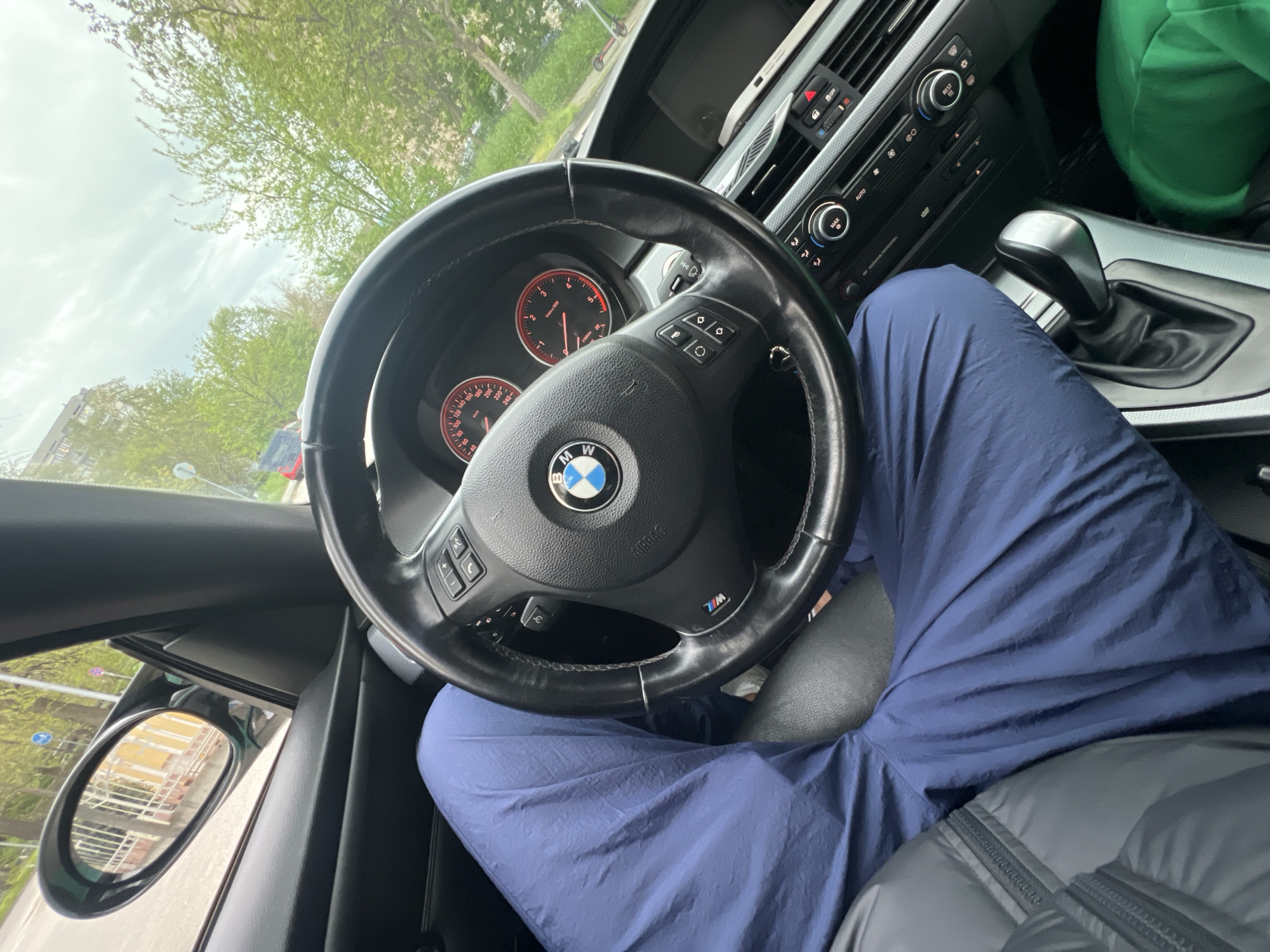 Couple visits Orthodox church in Plovdiv with mint BMW