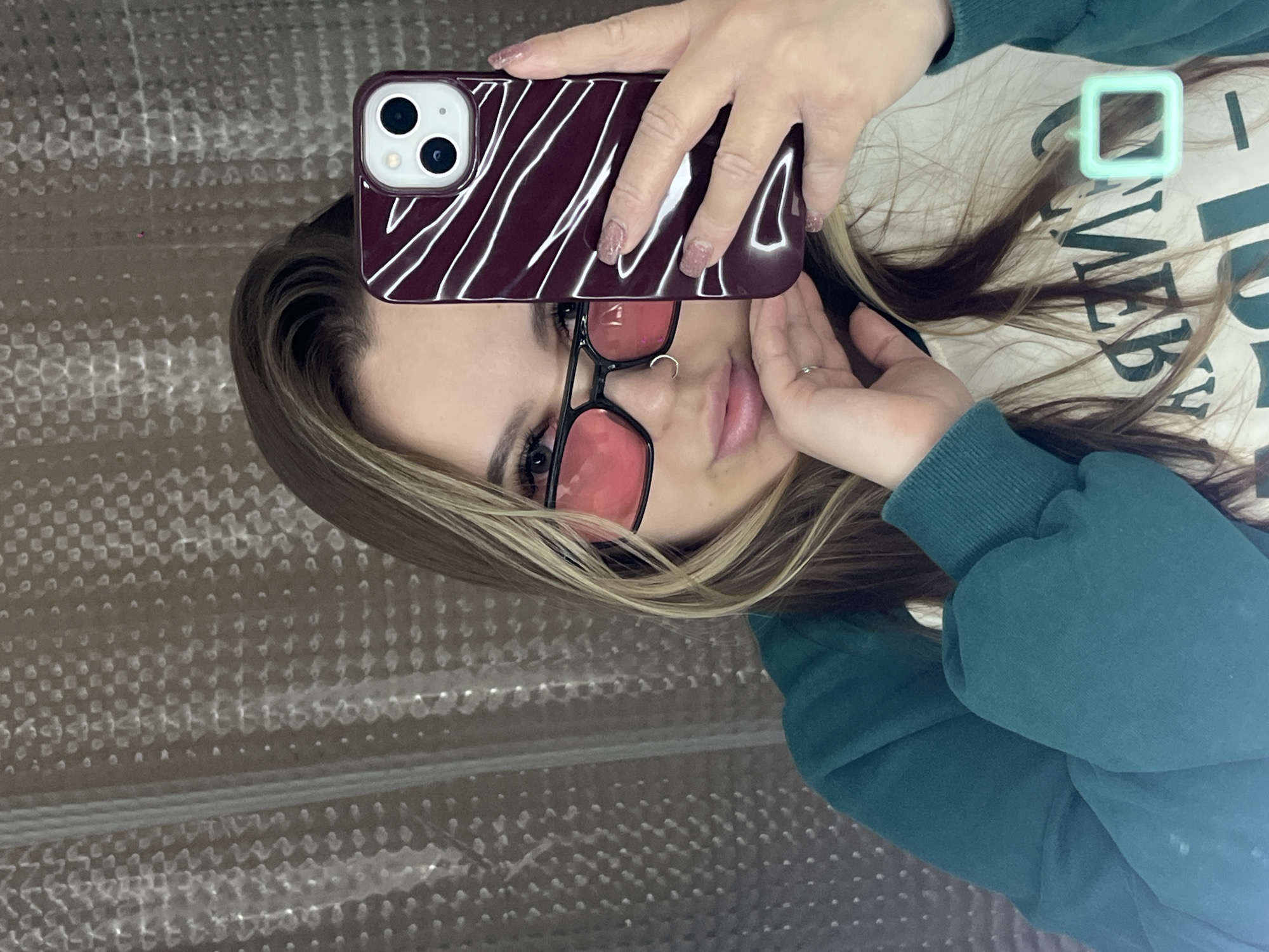 Young women take selfies indoors in Krasnodar, Russia