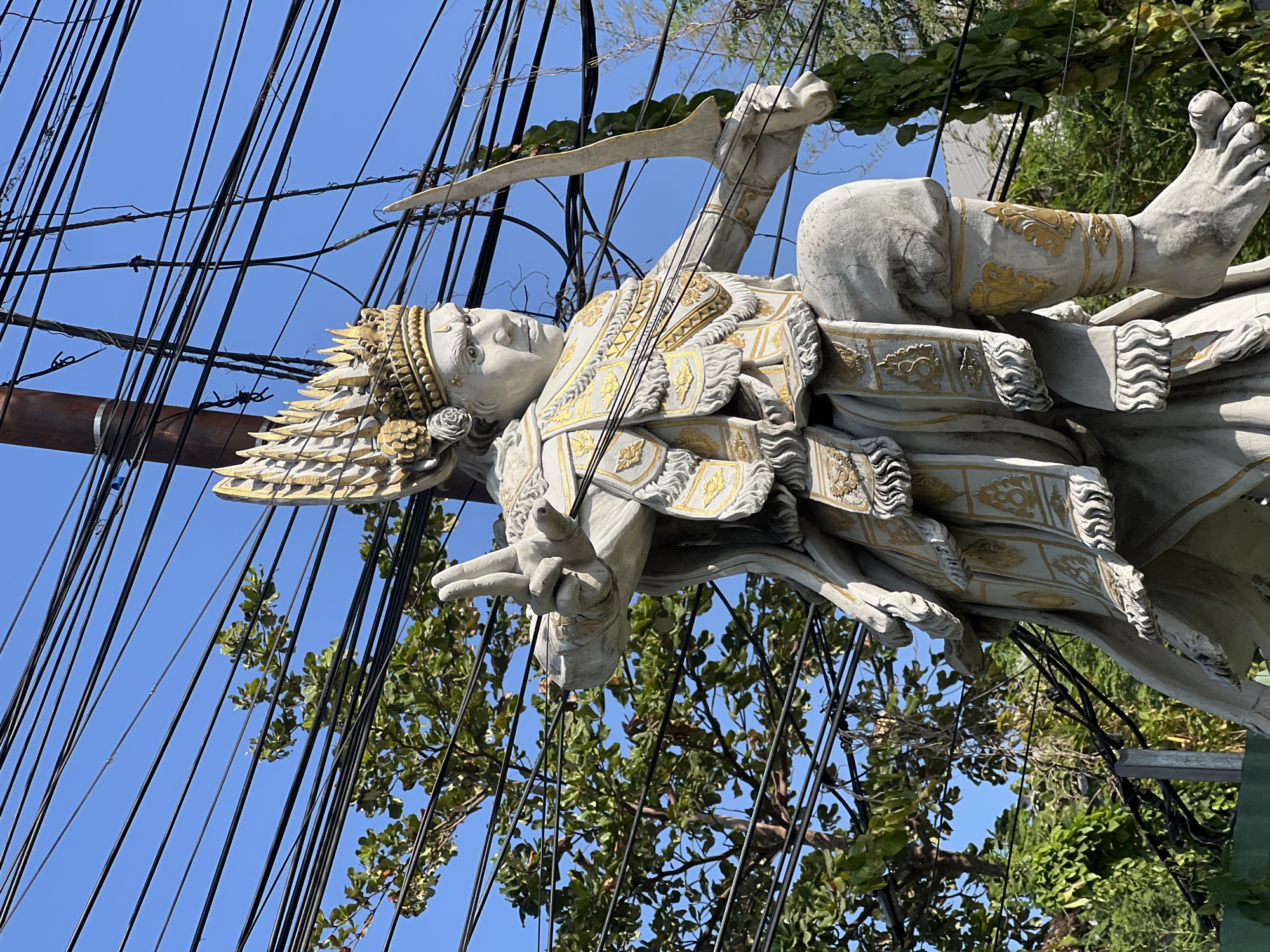 Morning ride through Denpasar's streets, statues, and traffic
