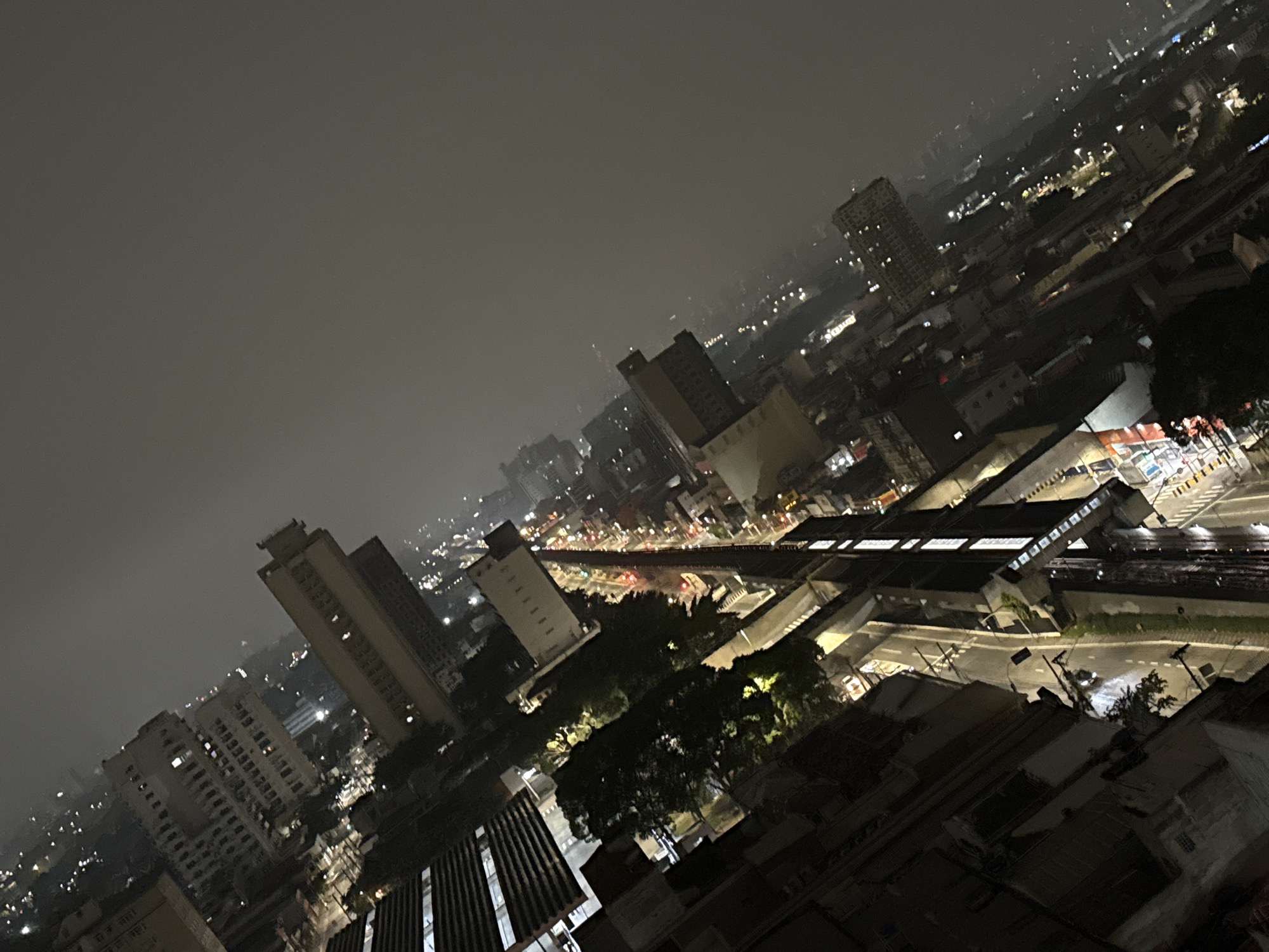 Foggy nighttime aerial view captured over São Paulo skyline