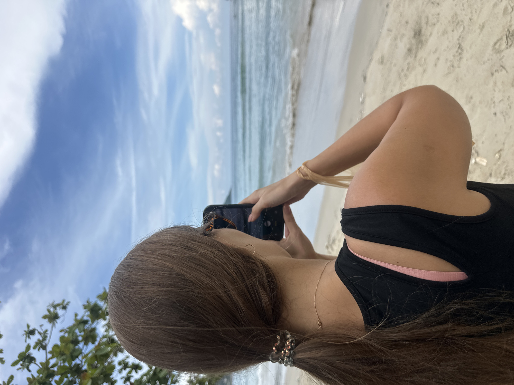 Coffee and phone in hand on Karon Beach
