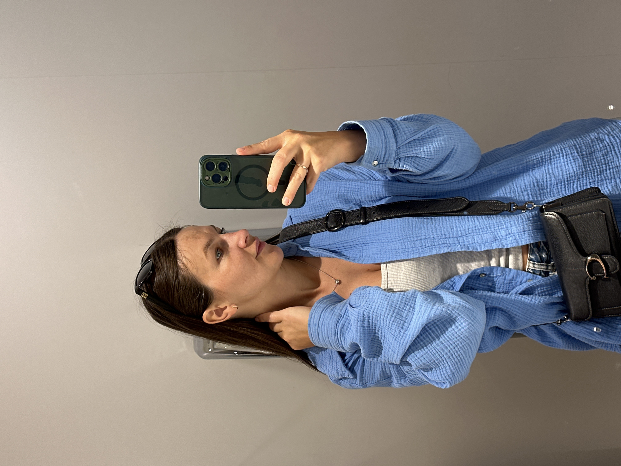 Woman takes selfie near waterway building