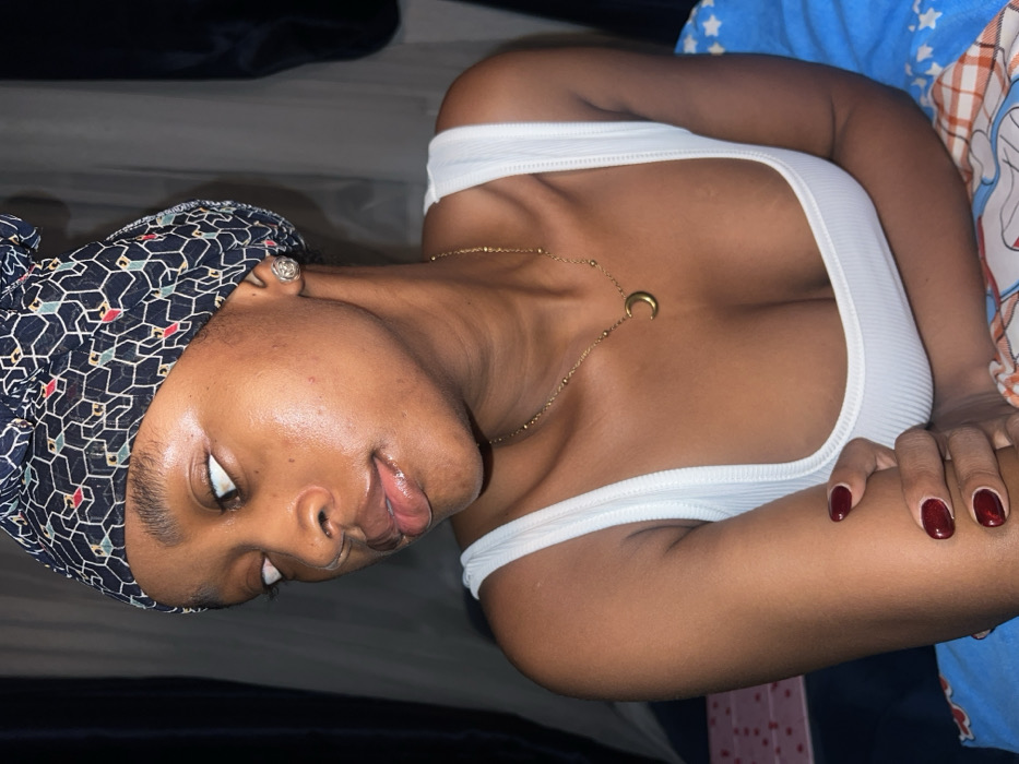 Woman poses for bedroom photos in Lagos