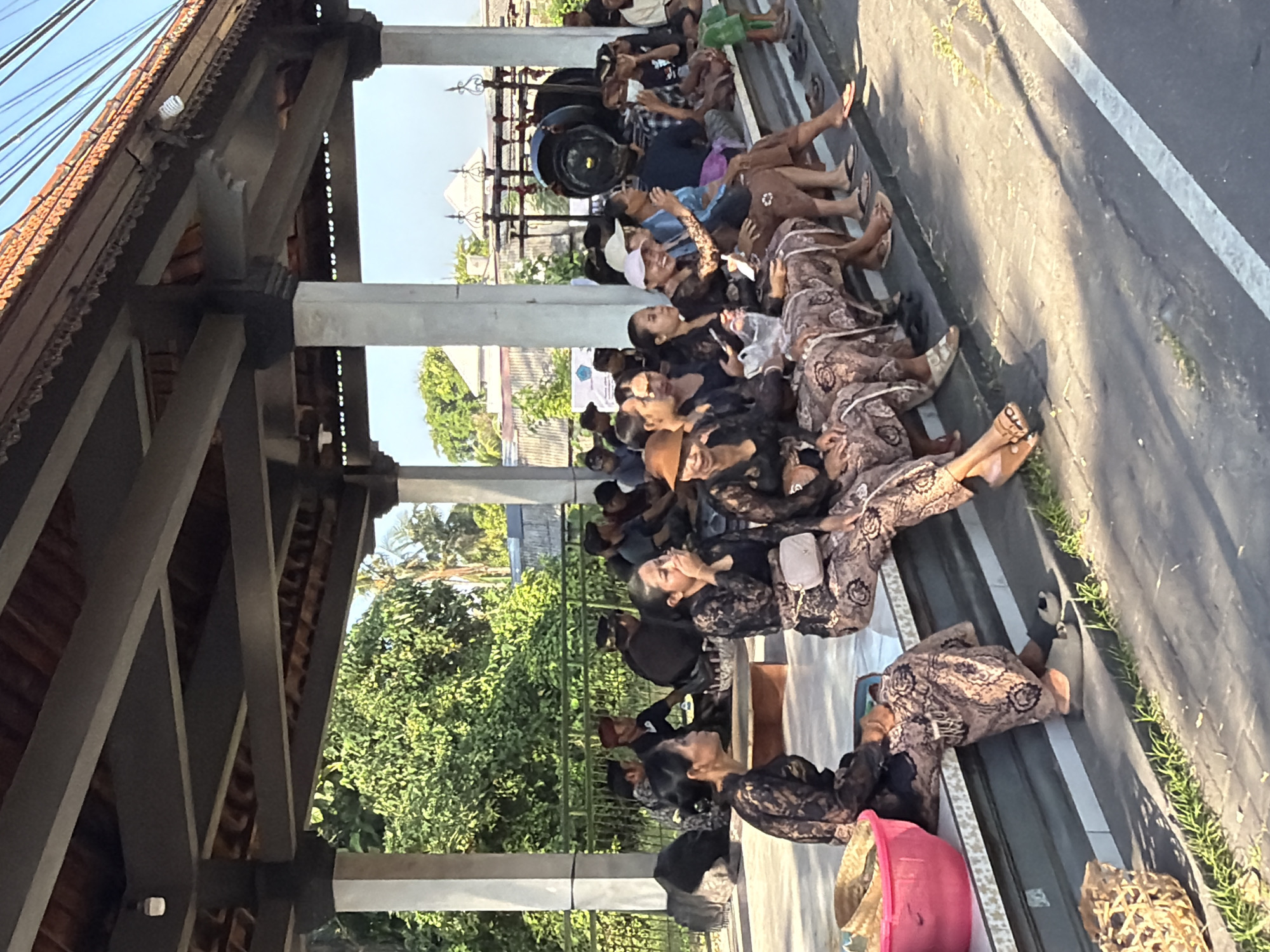 Traditional gathering under a pavilion in Mengwi, Bali