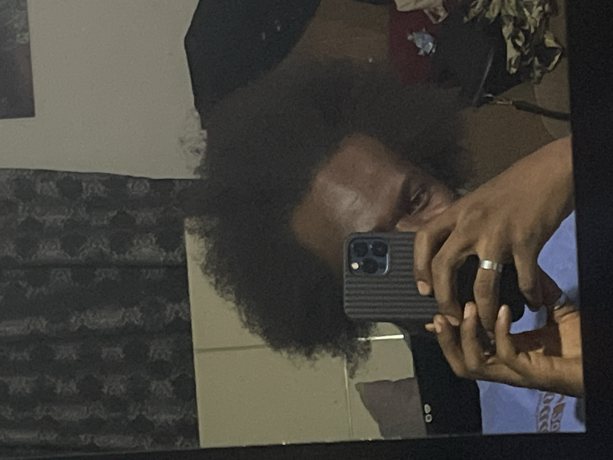 Man takes mirror selfies in Kuchingoro, Nigeria