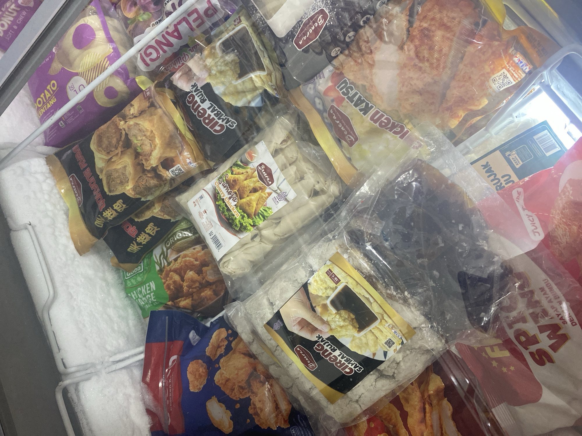 Browsing a stocked convenience store with live chickens nearby