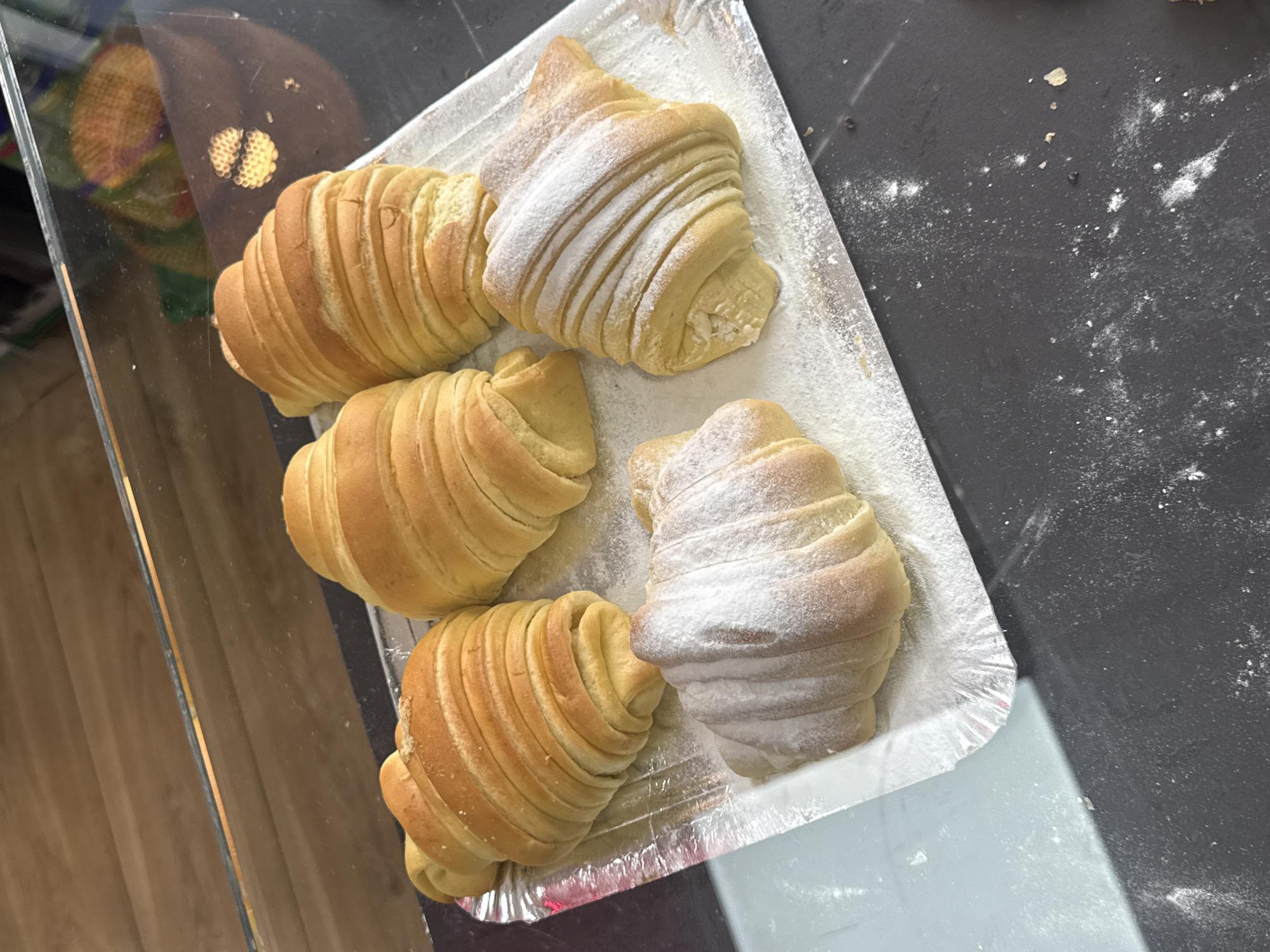 Morning food market displays fresh pastries and seafood