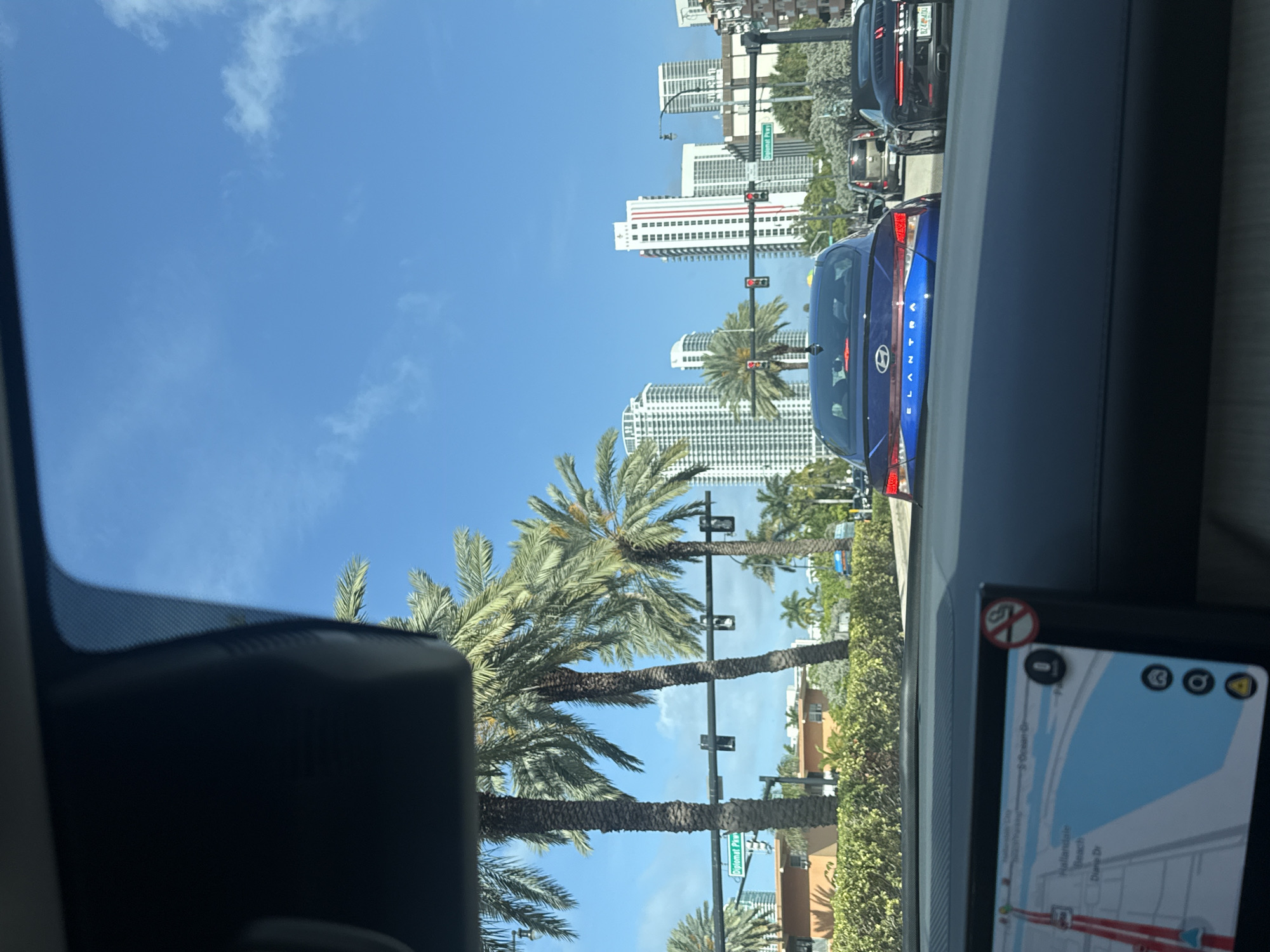 Driver documents evening journey past Hallandale Beach landmark water tower