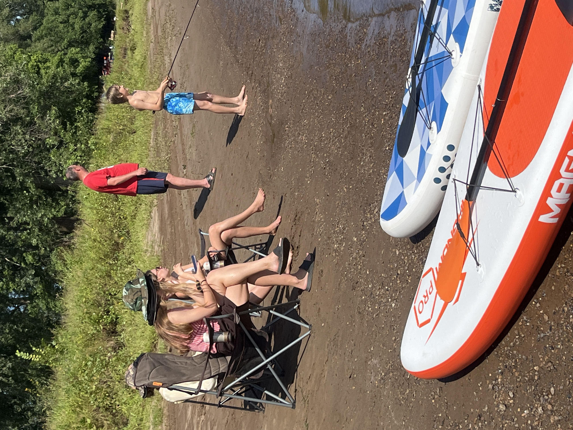 SUP boards on a sunny Russian riverbank