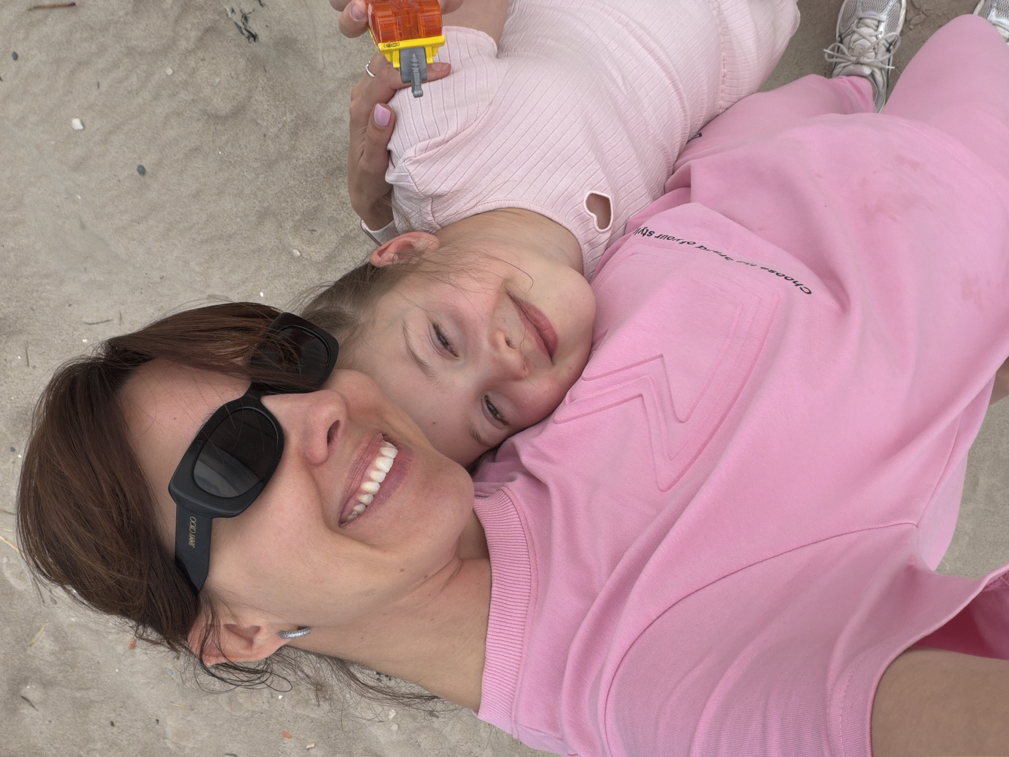 Mother and child enjoy sunny beach picnic in Latvia