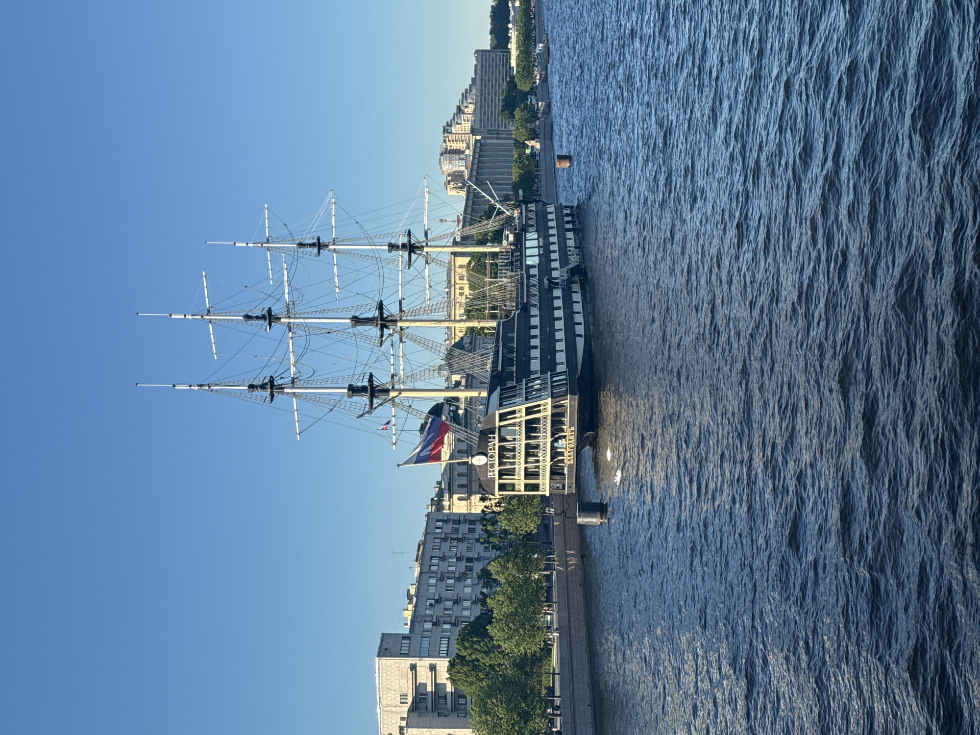 Tall ship restaurant on the Neva draws a crowd on a summer afternoon