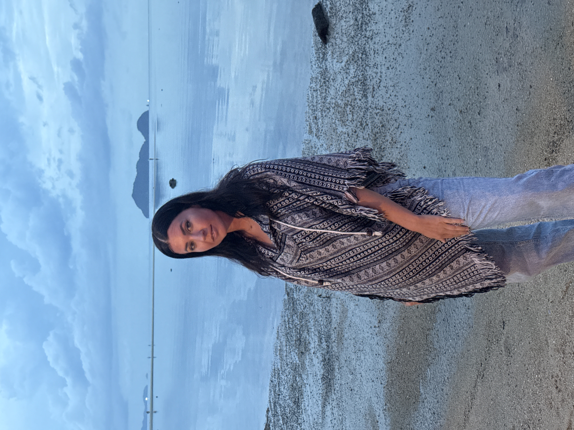 Woman poses at dusk on Thai beach