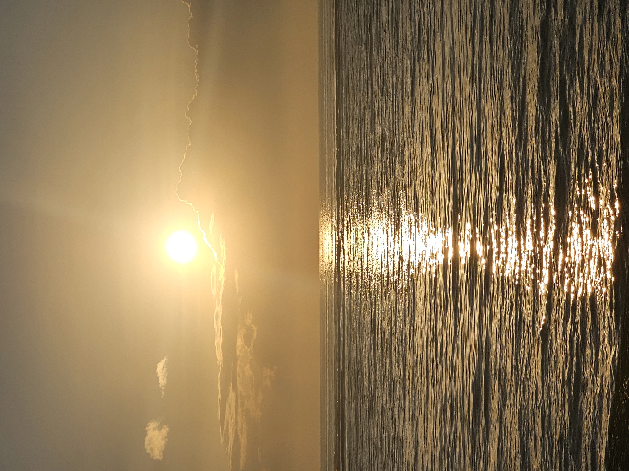Sunset at Sanur Beach, Bali's coastline at golden hour