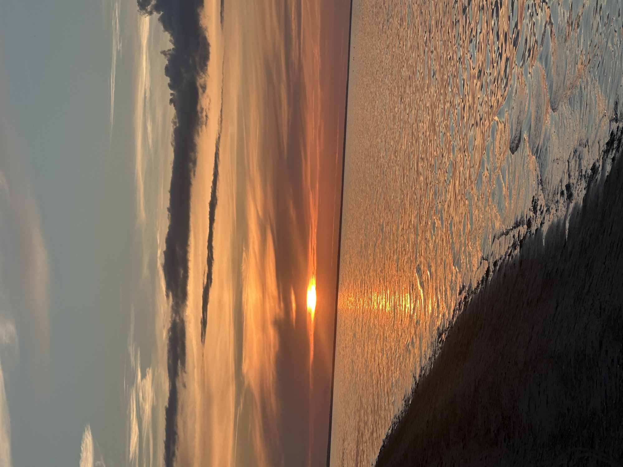 Baltic sunset glows orange over the Ragaciems coastline