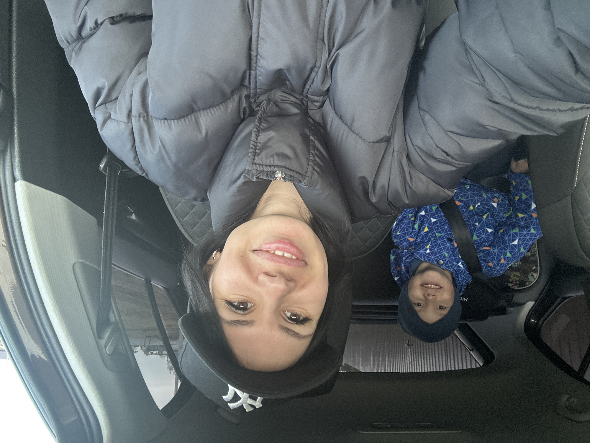Woman and child observed smiling together in car