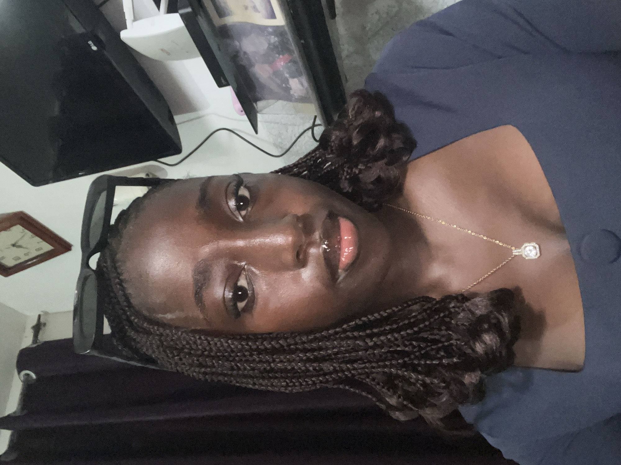 Woman photographed multiple times in navy dress, Abuja Nigeria
