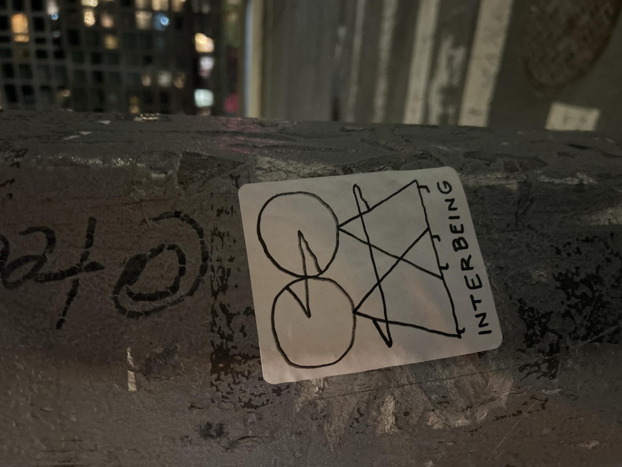 Hand-drawn geometric sticker documented on NYC surface