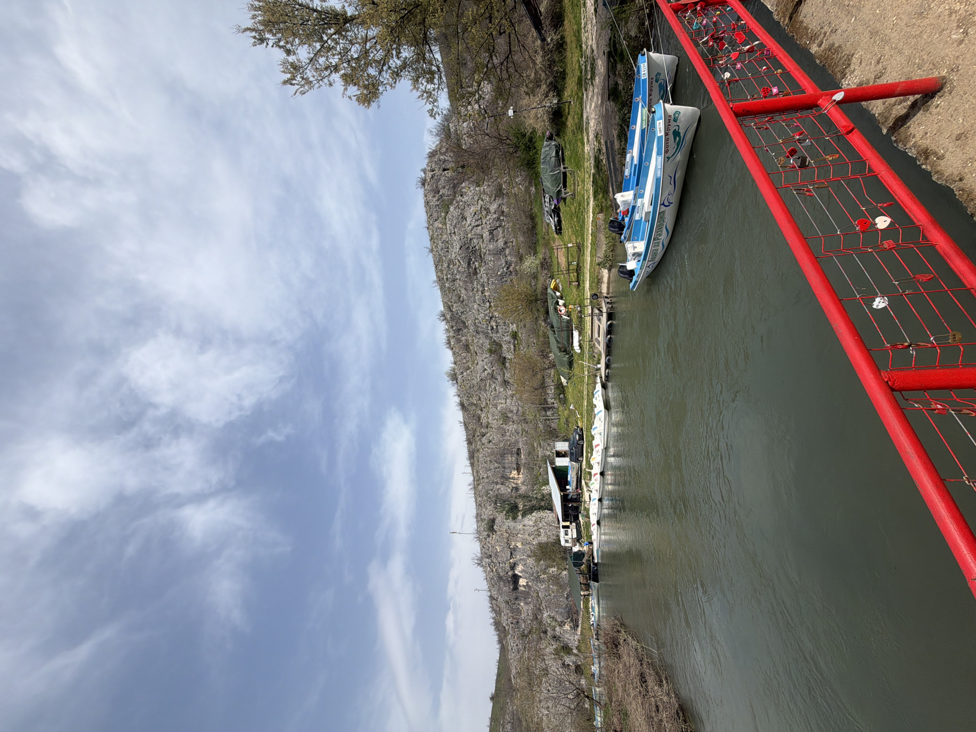 Passenger boats docked along river in Lukovit, Bulgaria