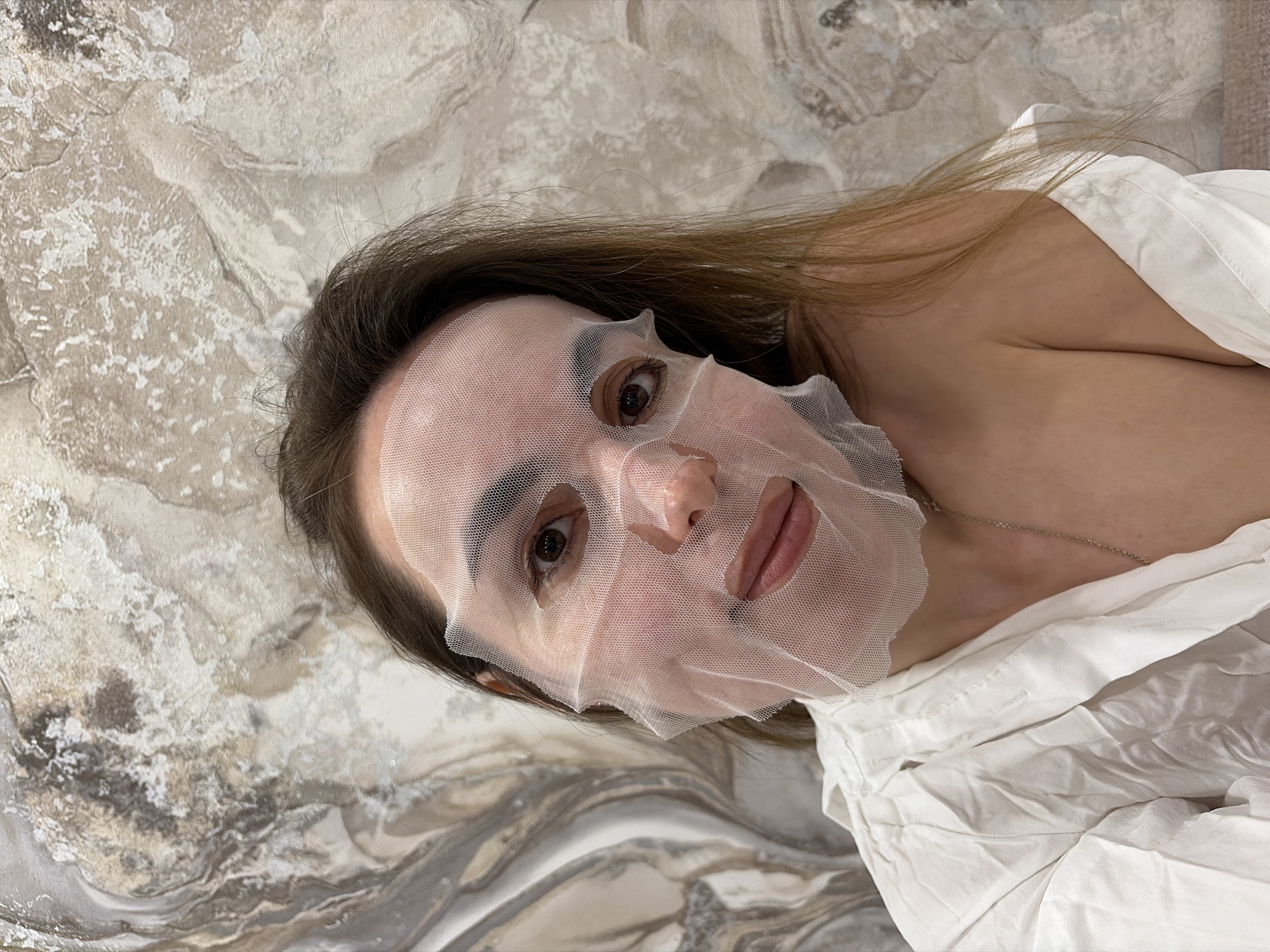 Woman's evening skincare routine documented in Izhevsk apartment