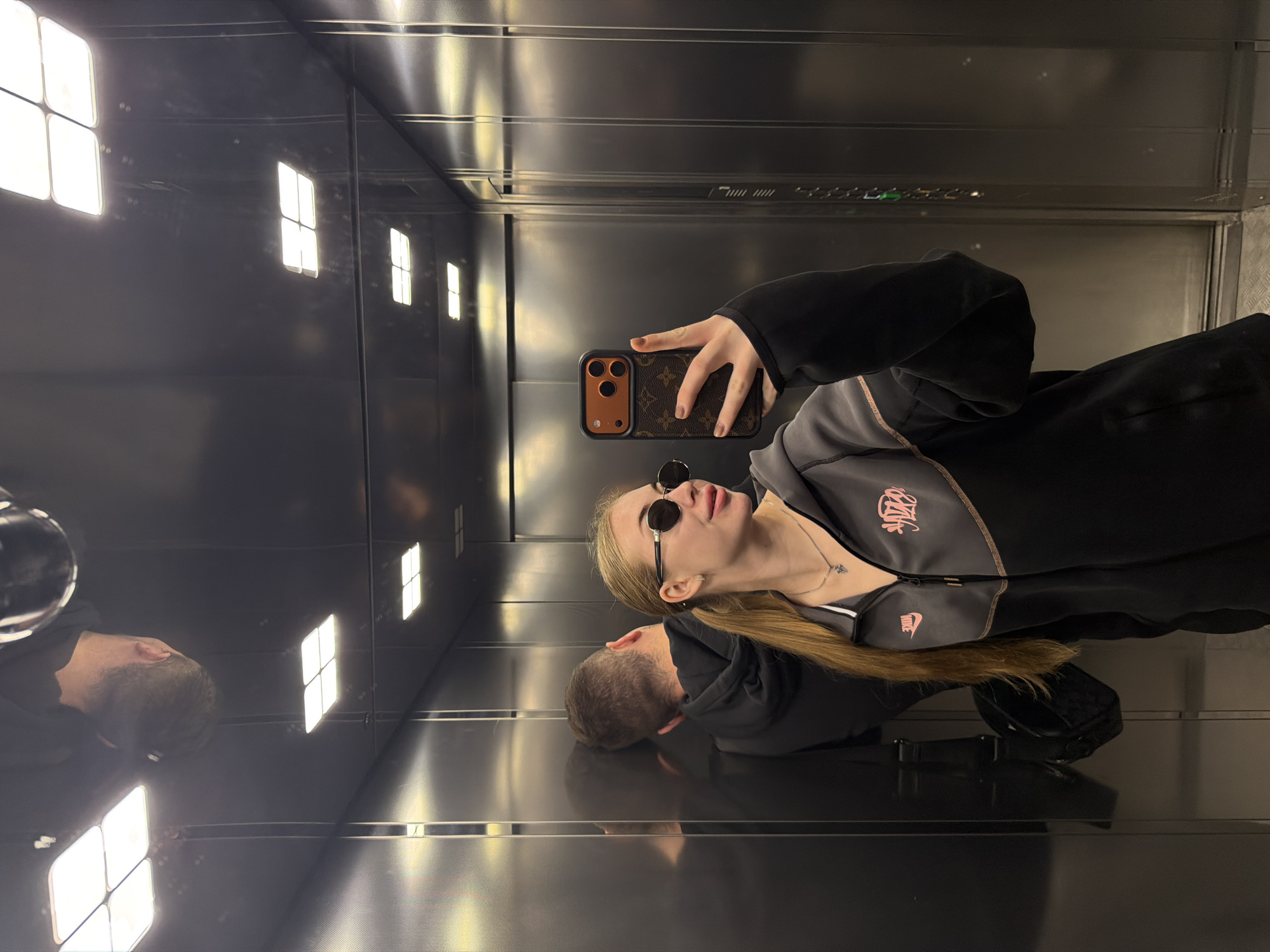 Morning coffee run with a quick elevator selfie stop