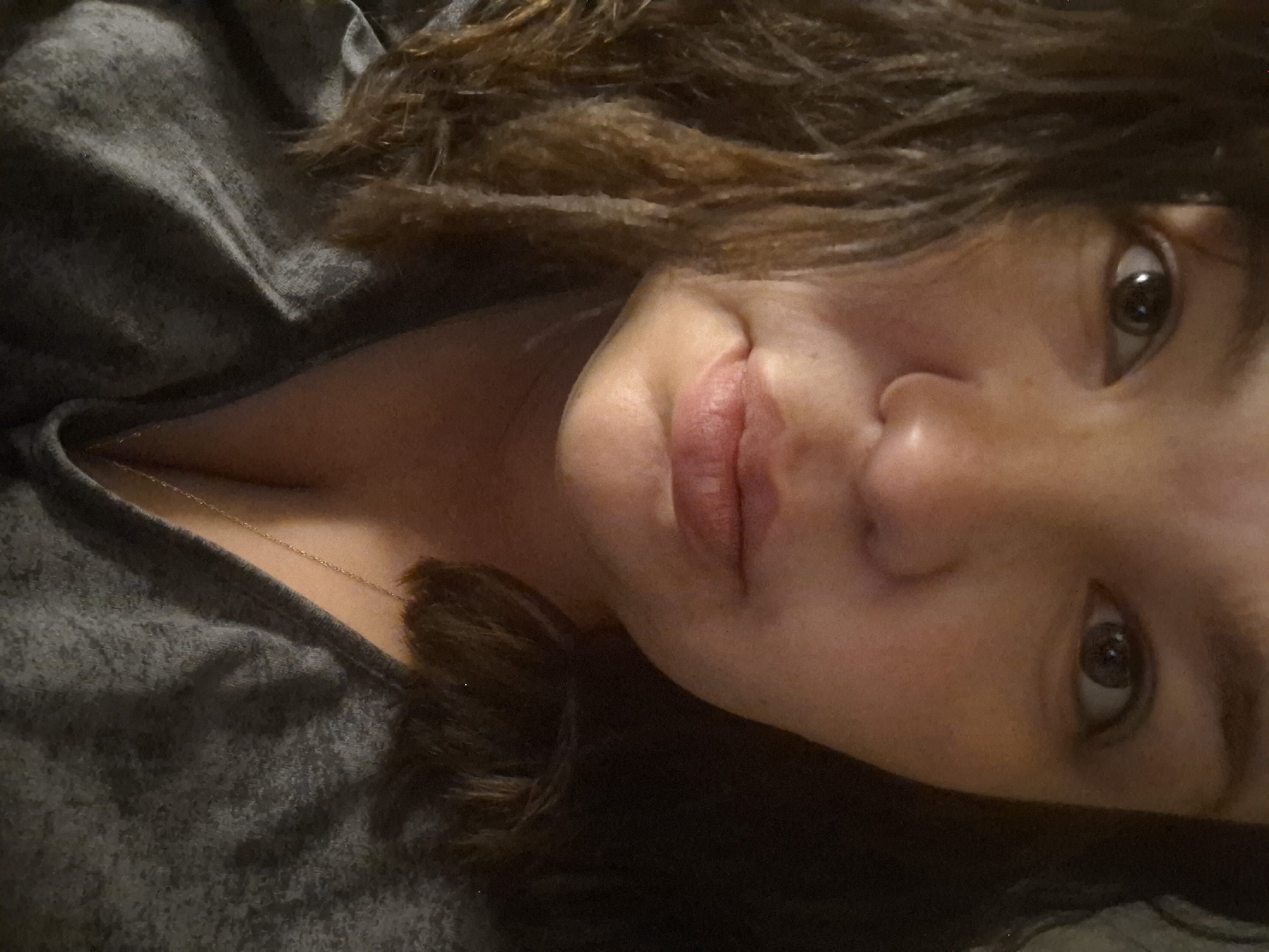 Portrait photograph captured of unidentified woman gazing at camera