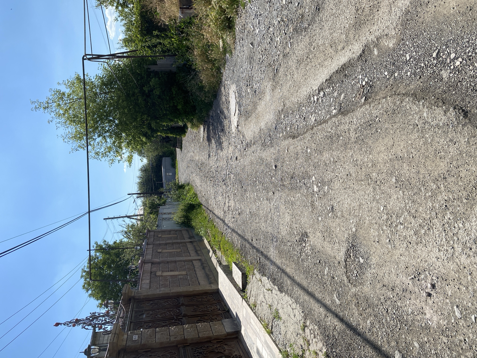 Quiet streets and stone buildings in Gyumri on a sunny afternoon.