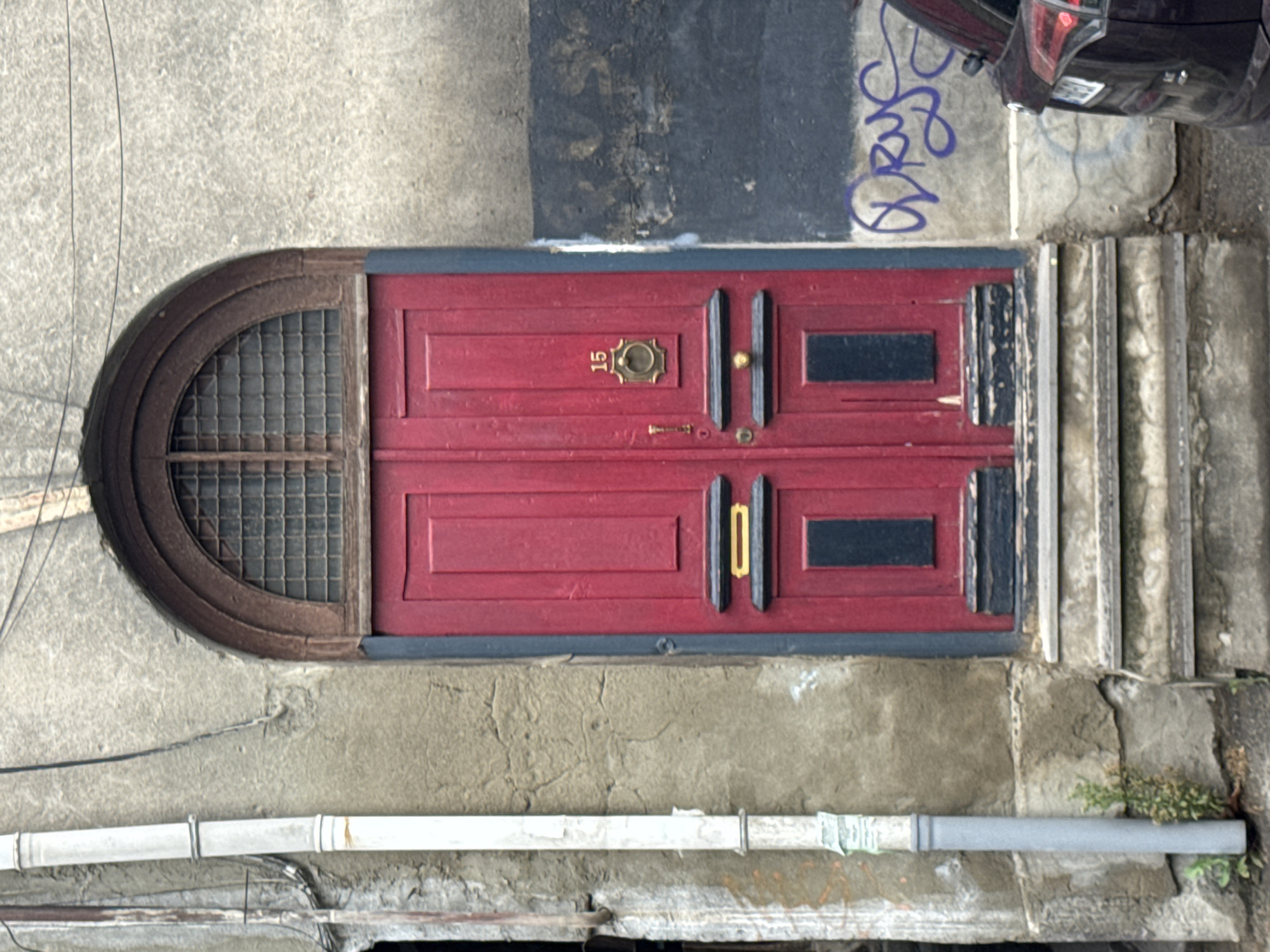 Red arched doorway photographed in Tbilisi, Georgia