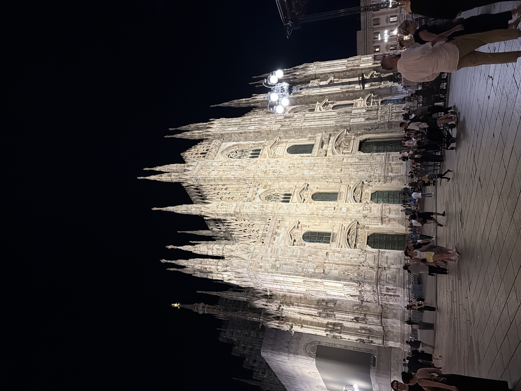 Nighttime documentation of illuminated Milan Cathedral architecture and interiors