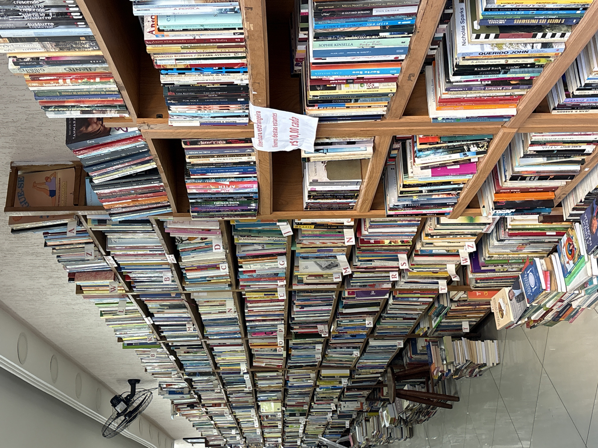 São Paulo street-level mix: bookstore, graffiti, urban skyline, retail