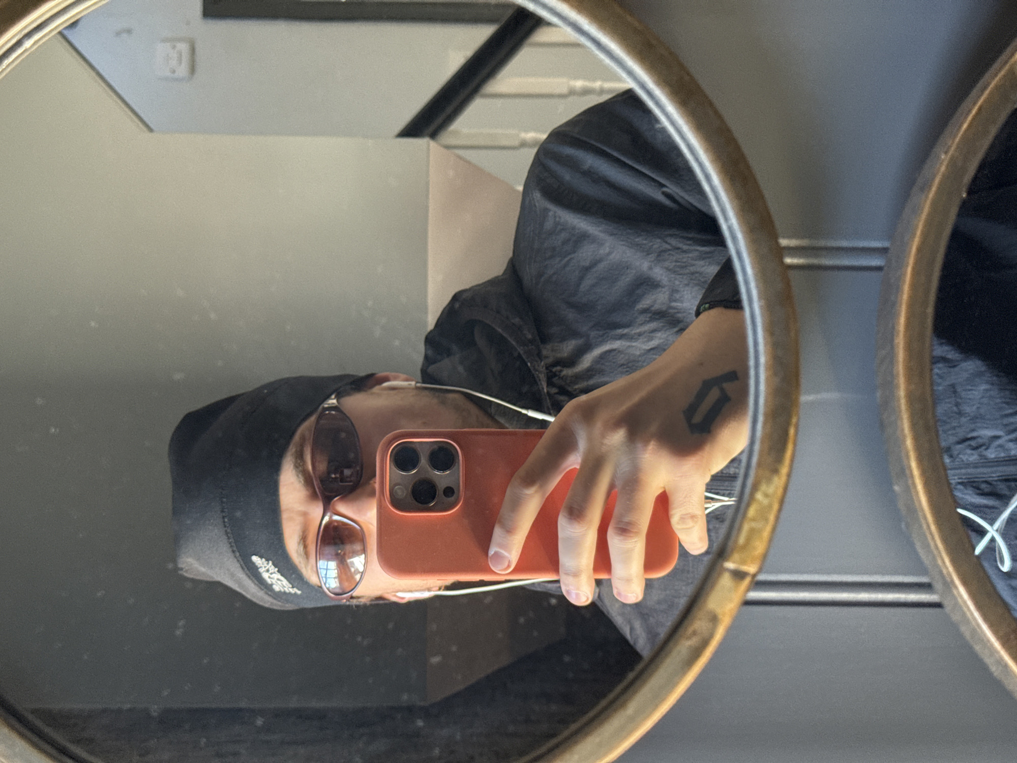 Person Takes Rotated Mirror Selfies in Stotfold Home