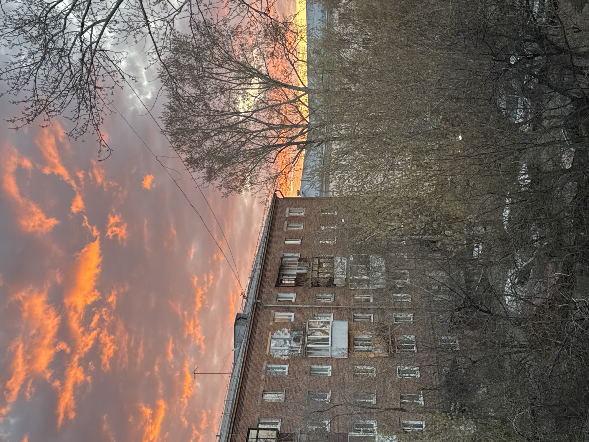 Sunset photographed over brick building in Irkutsk, Russia