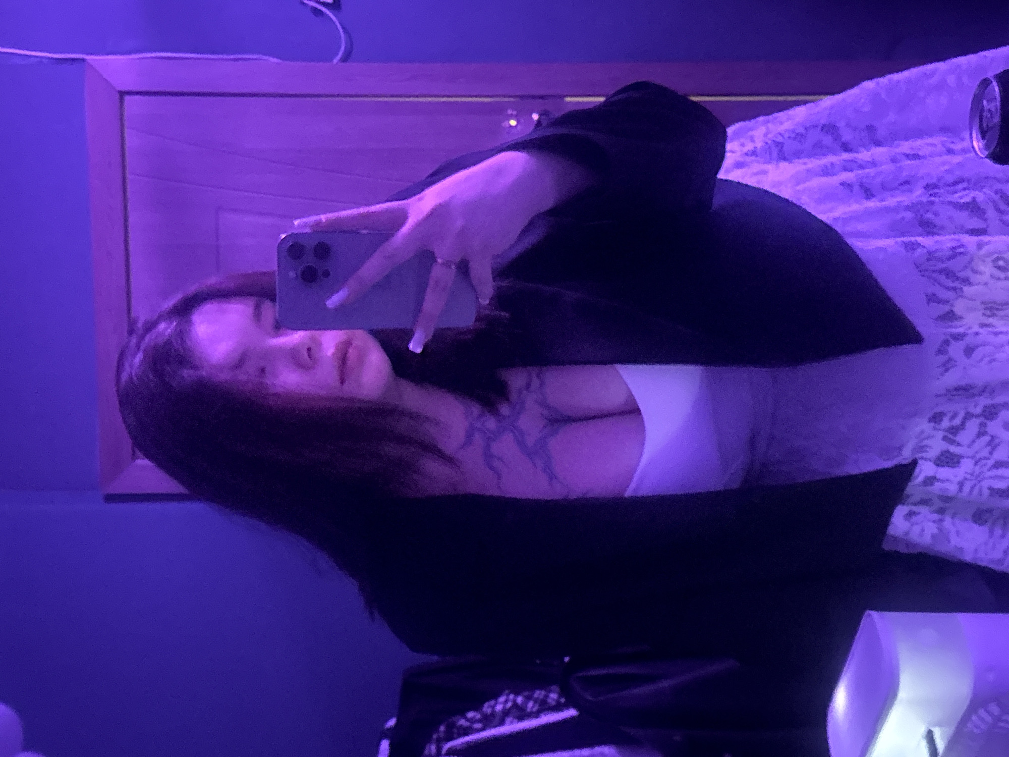 Moody bedroom selfie session under purple and blue lights, Surgut