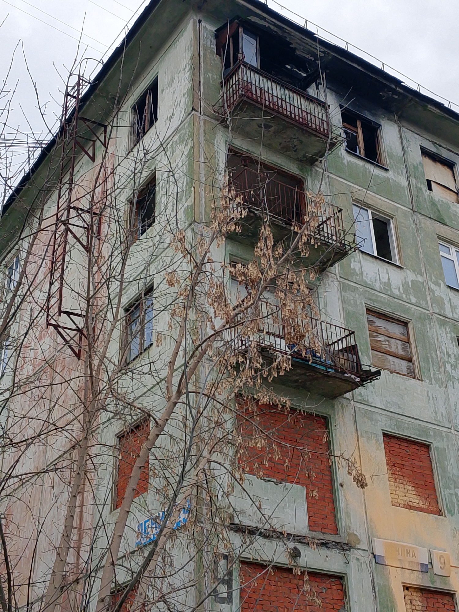 Deteriorating apartment buildings and WWII memorial documented in Izhevsk