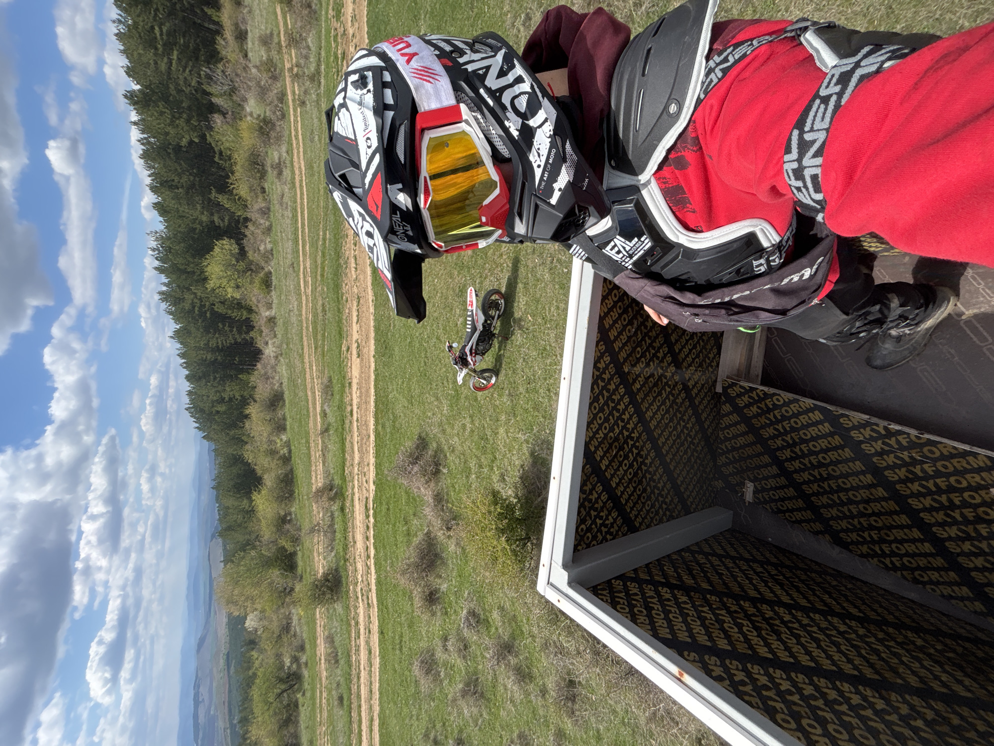 Motocross rider prepares for dirt bike session in Bulgarian countryside