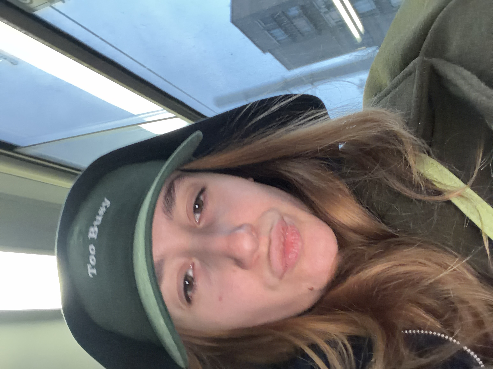 Woman takes selfies on busy Sofia street during afternoon